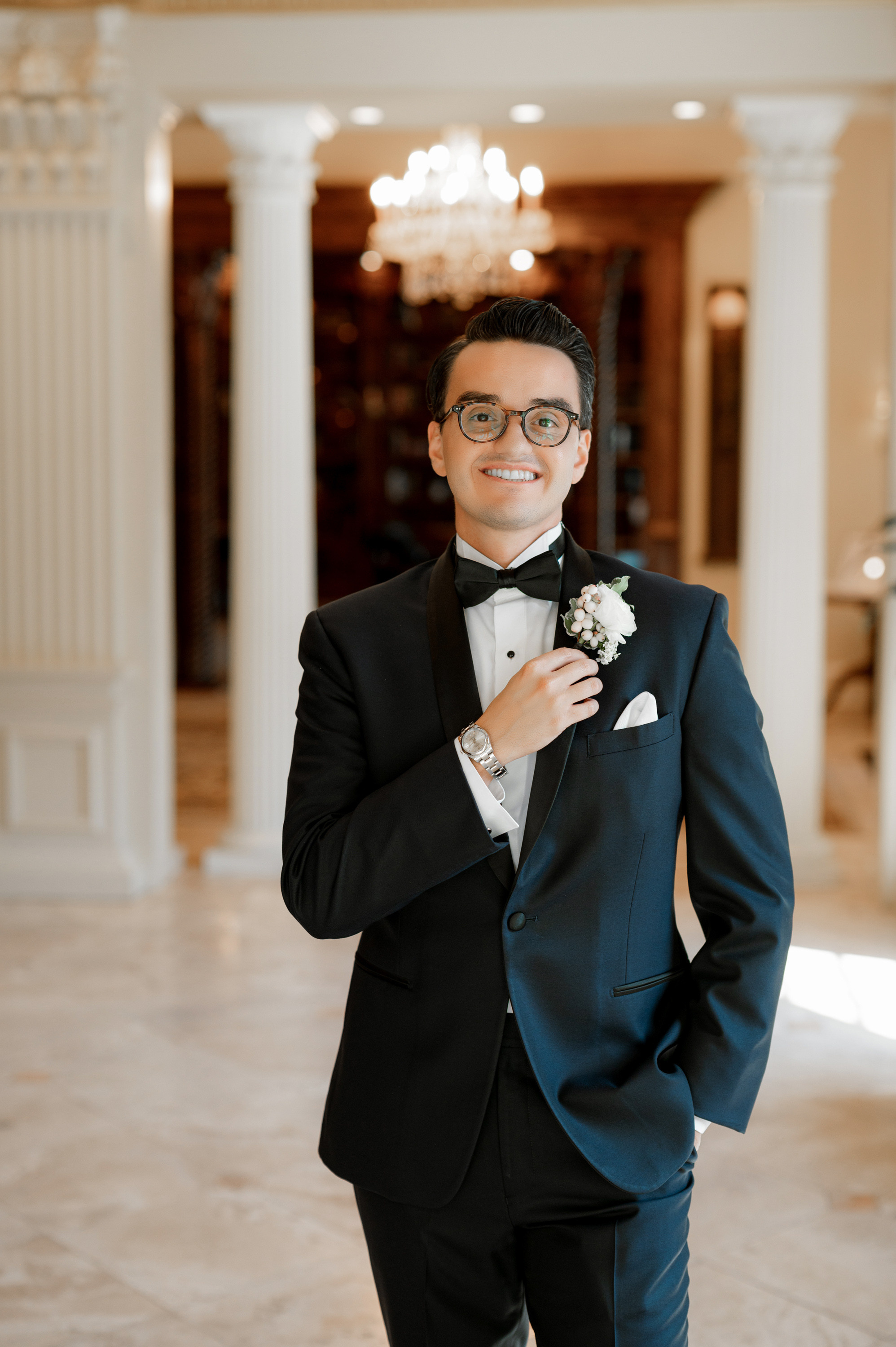 a man in a tuxed suit and bow tie
