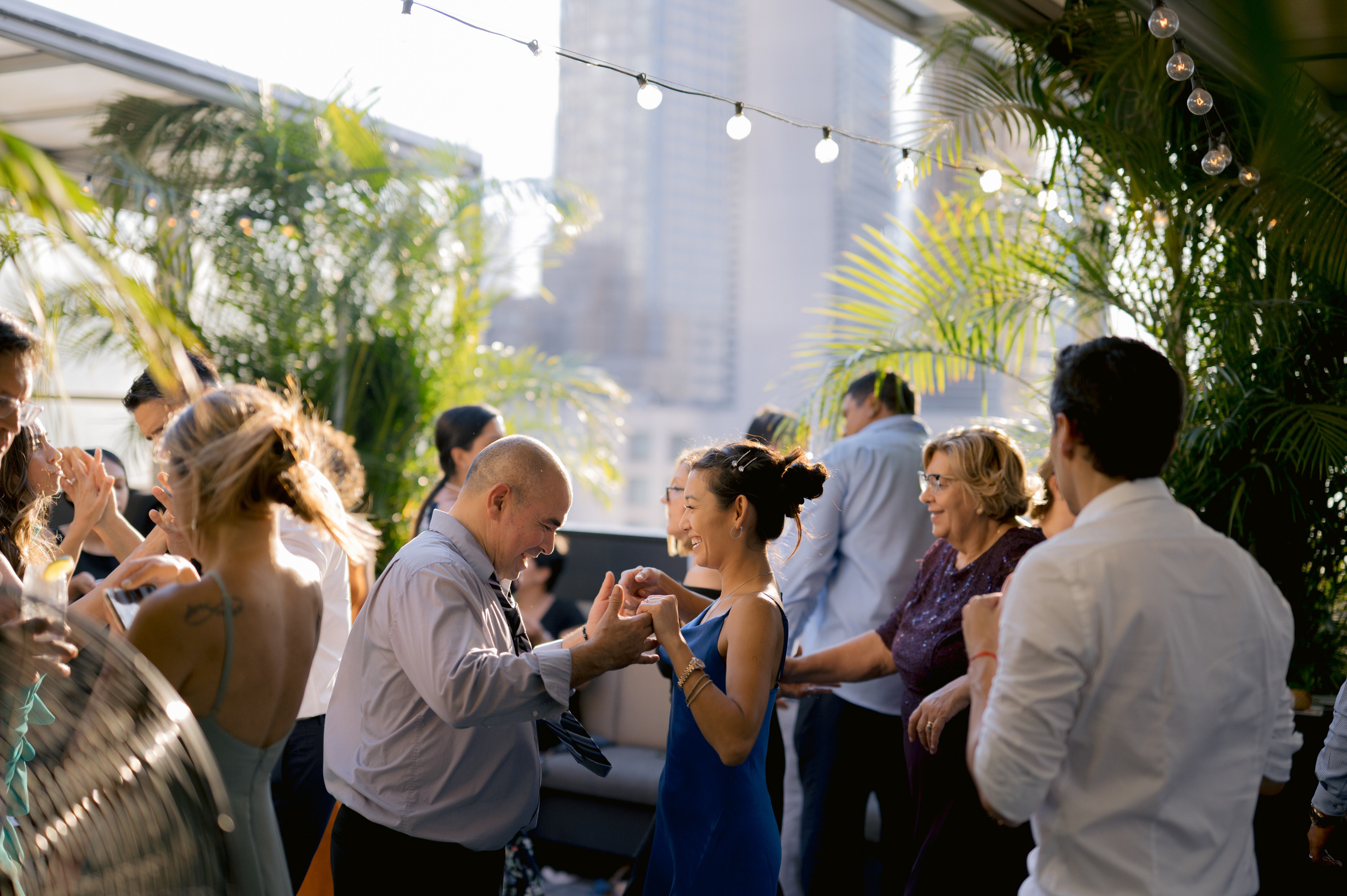 a group of people standing around a table
