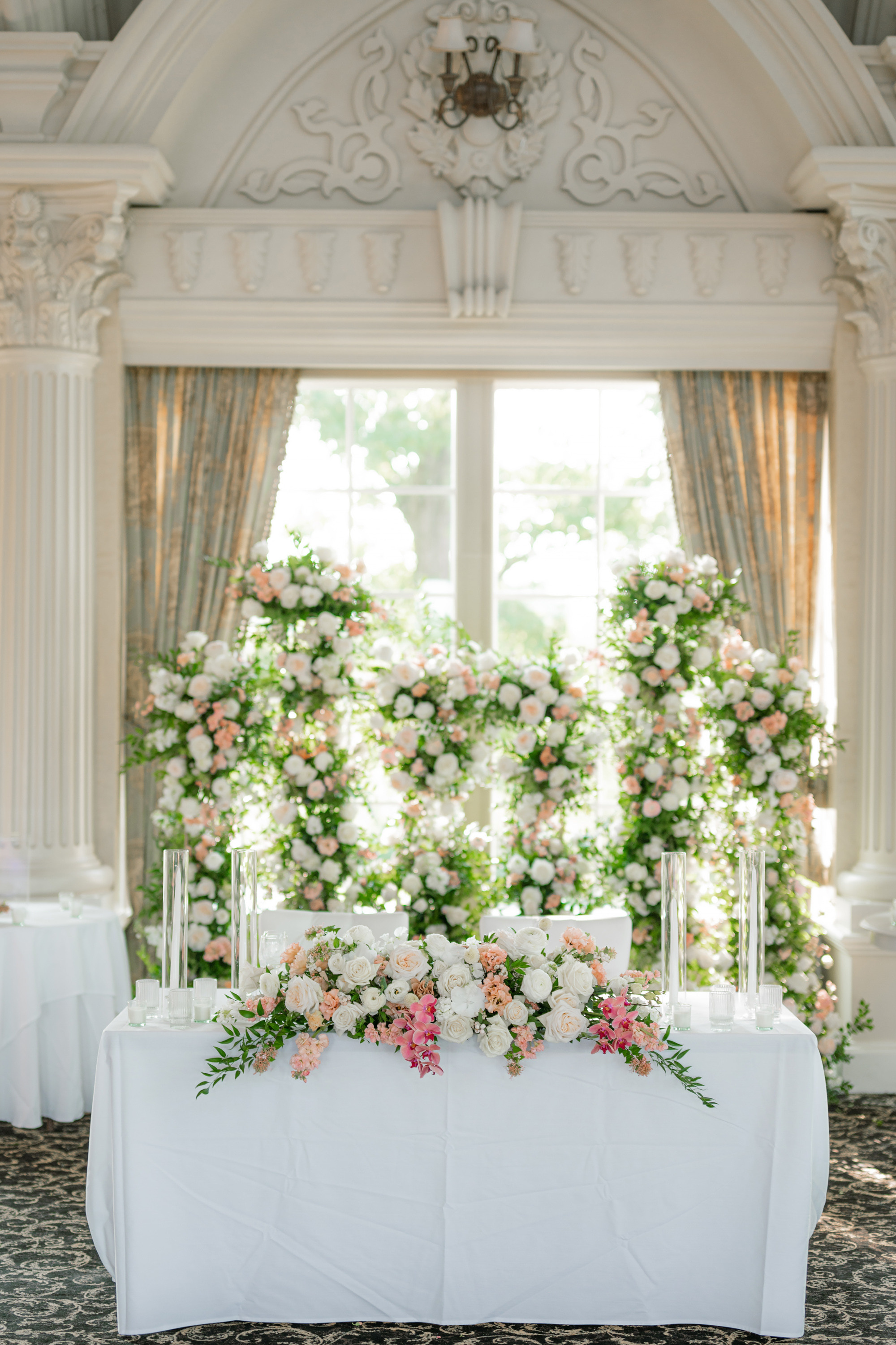 a table with flowers and candles on it