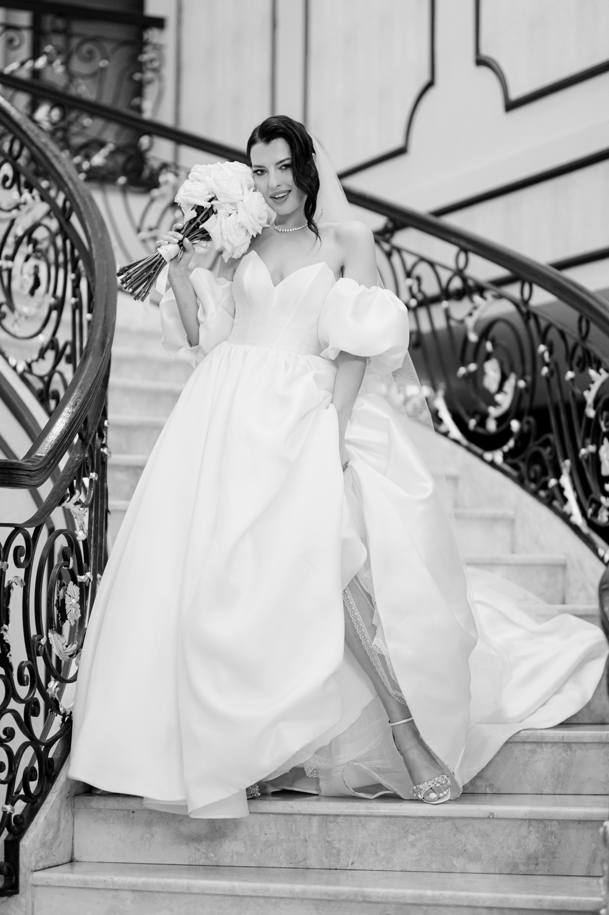 a bride walking down the stairs at the hotel