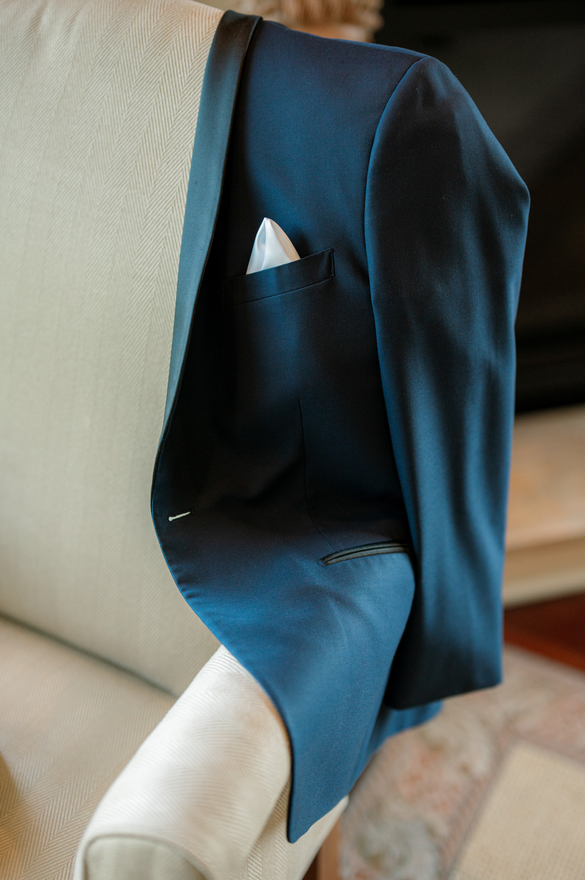 a close up of a blue suit on a couch