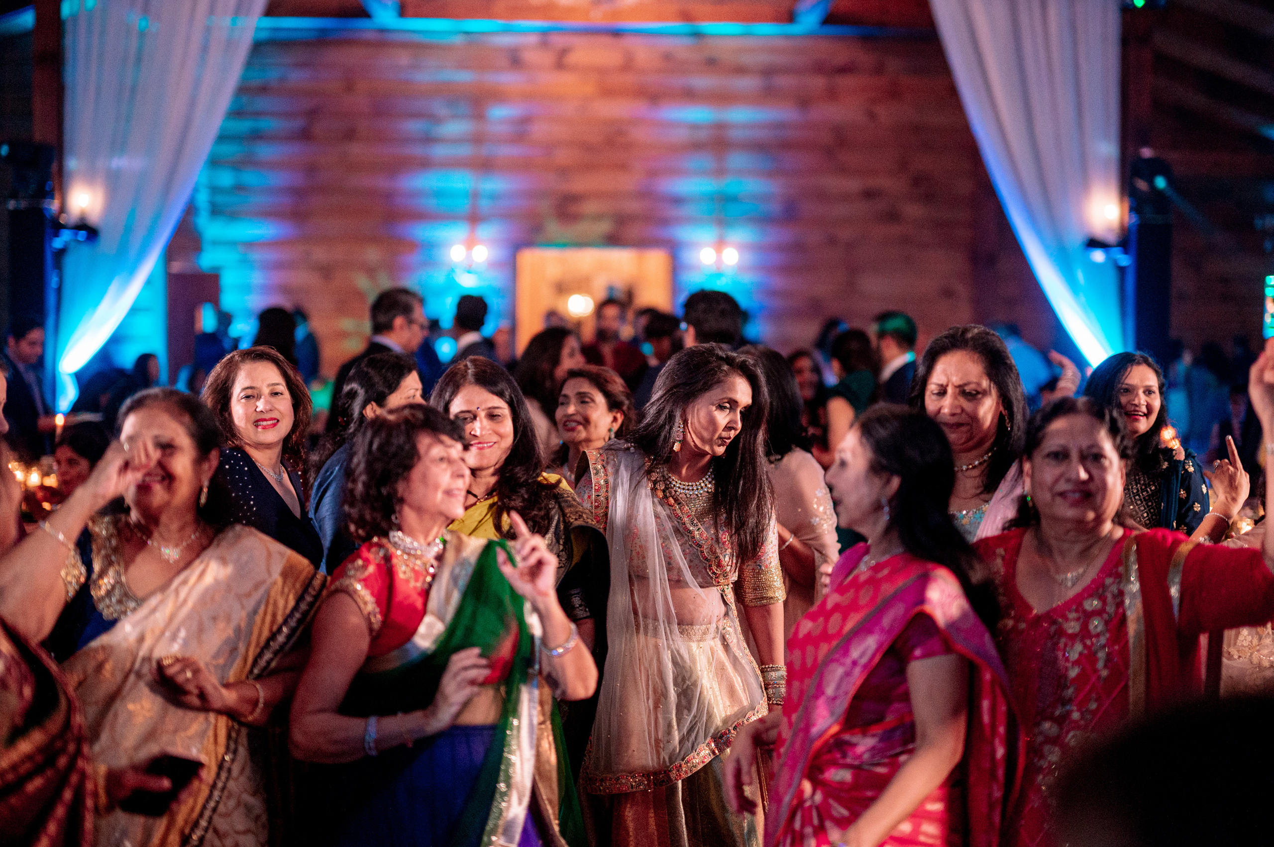 a group of people standing around a dance floor