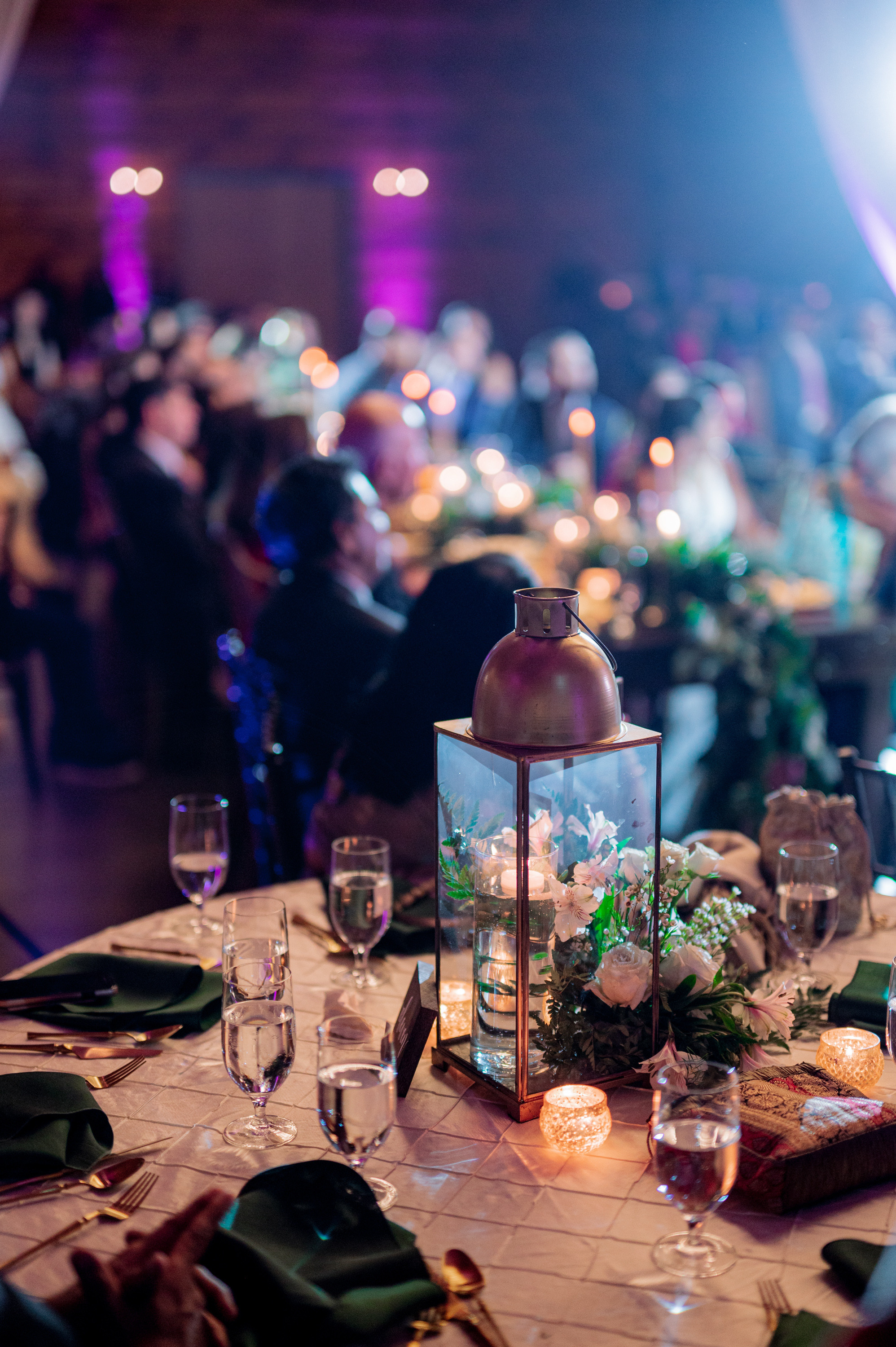 a table with a candle and a lantern on it
