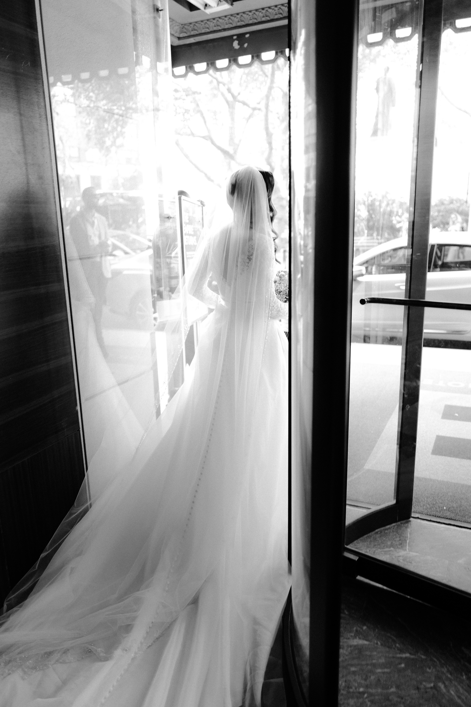 a bride is walking out of the door