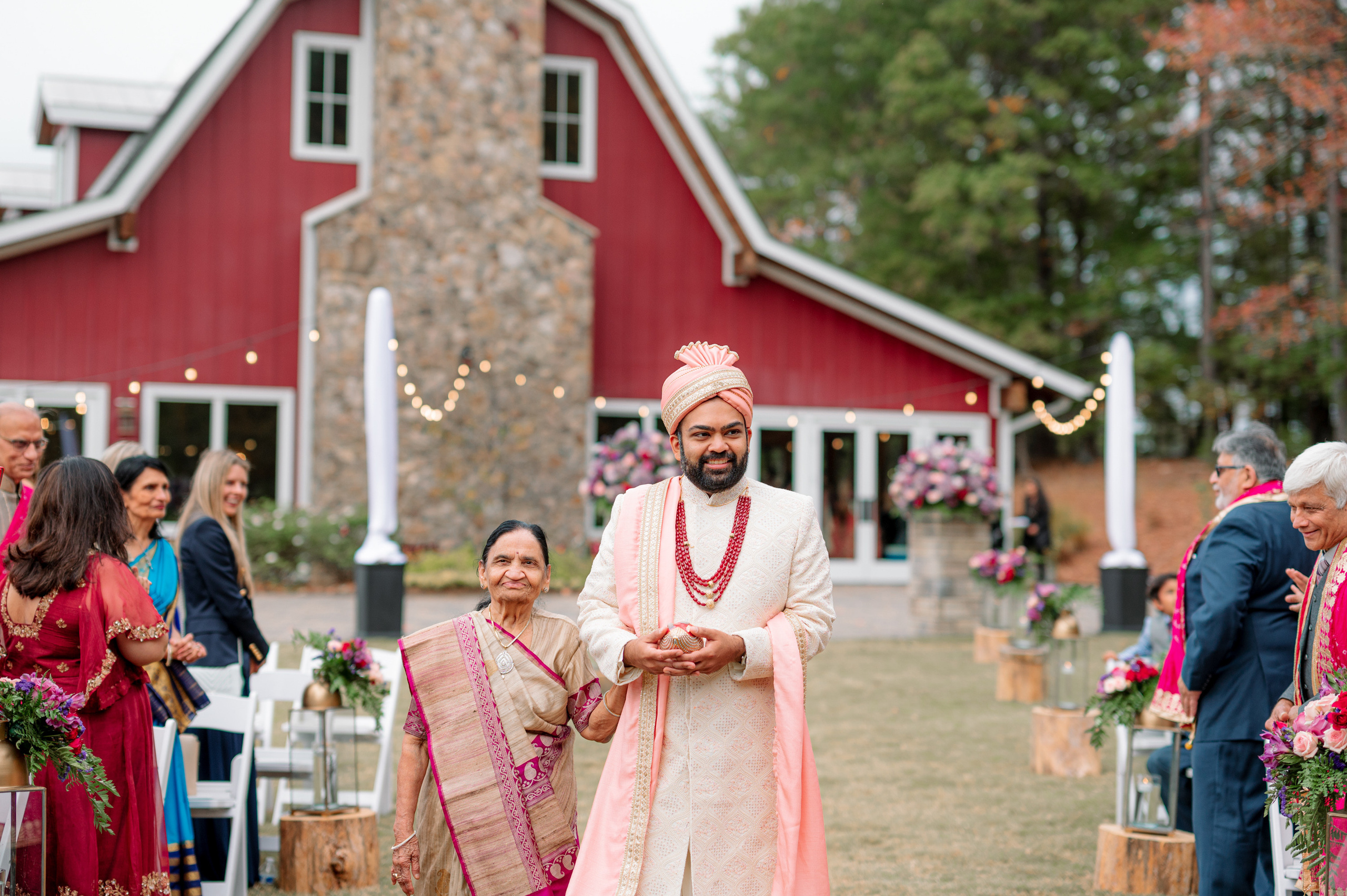 a man and woman walking down the aisle