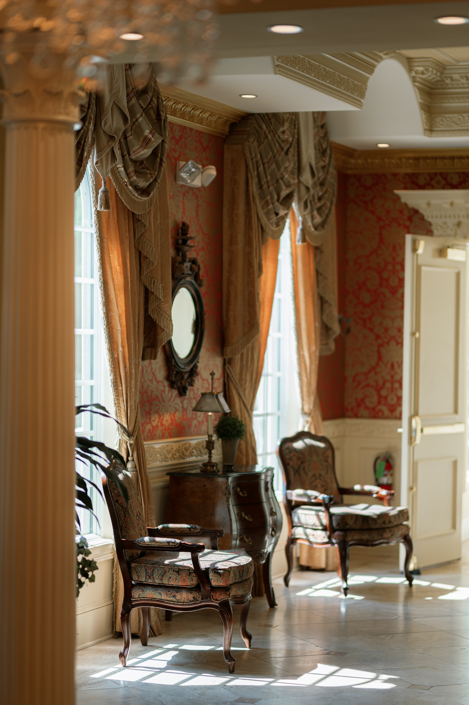 a room with a chair and a mirror