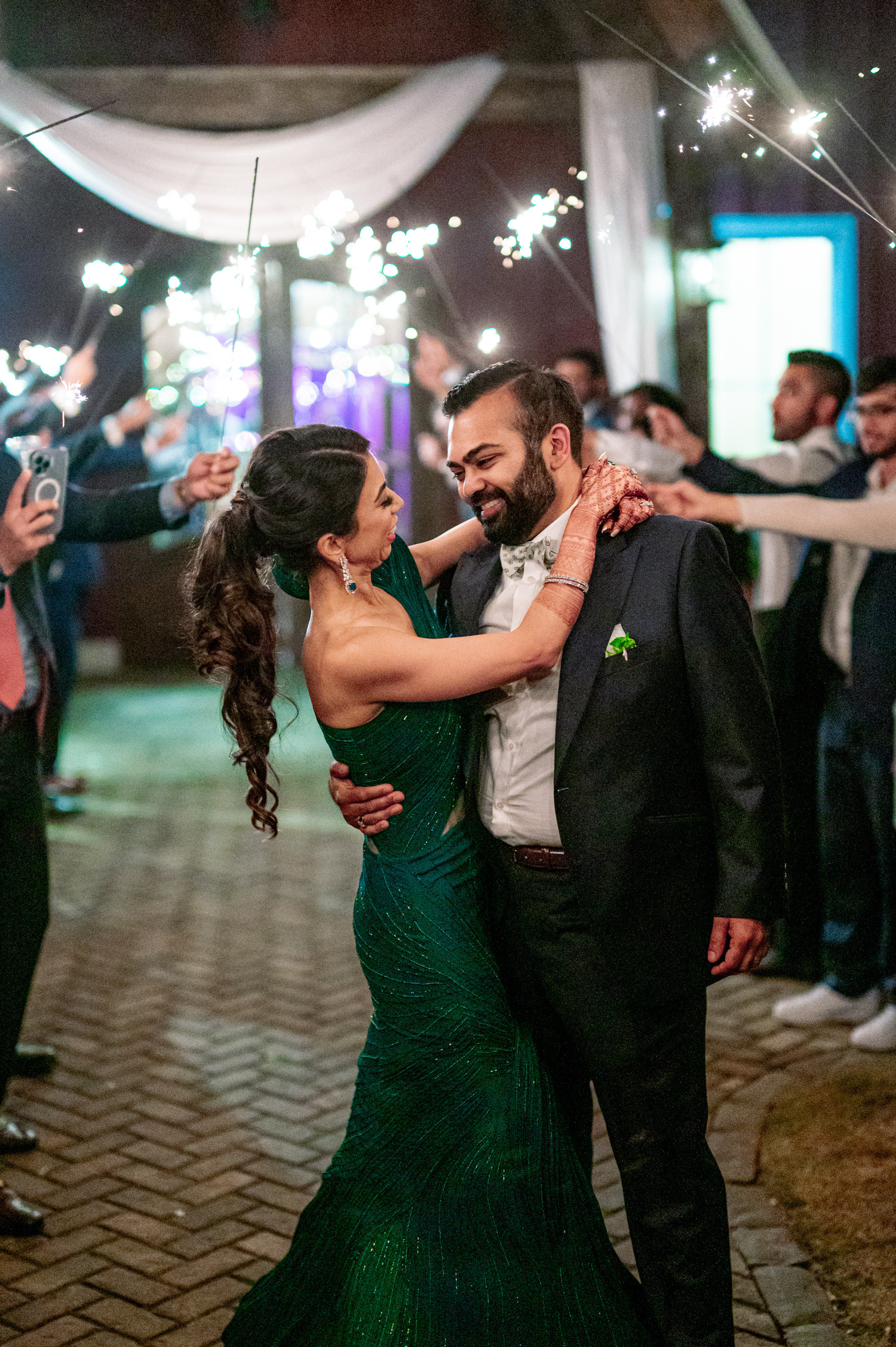 a couple dancing with sparkle in their hands