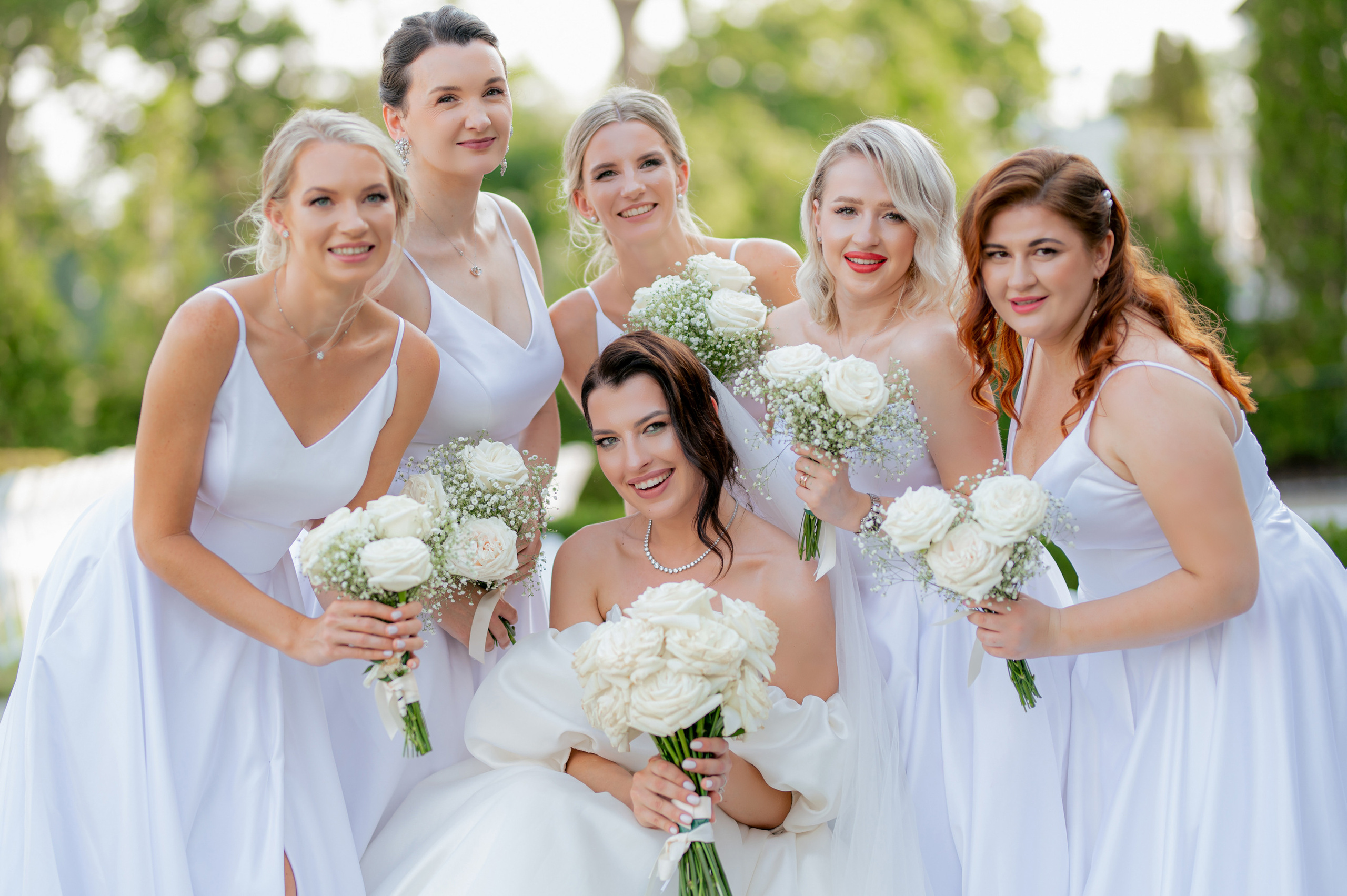 a group of bridesmaids posing for a photo