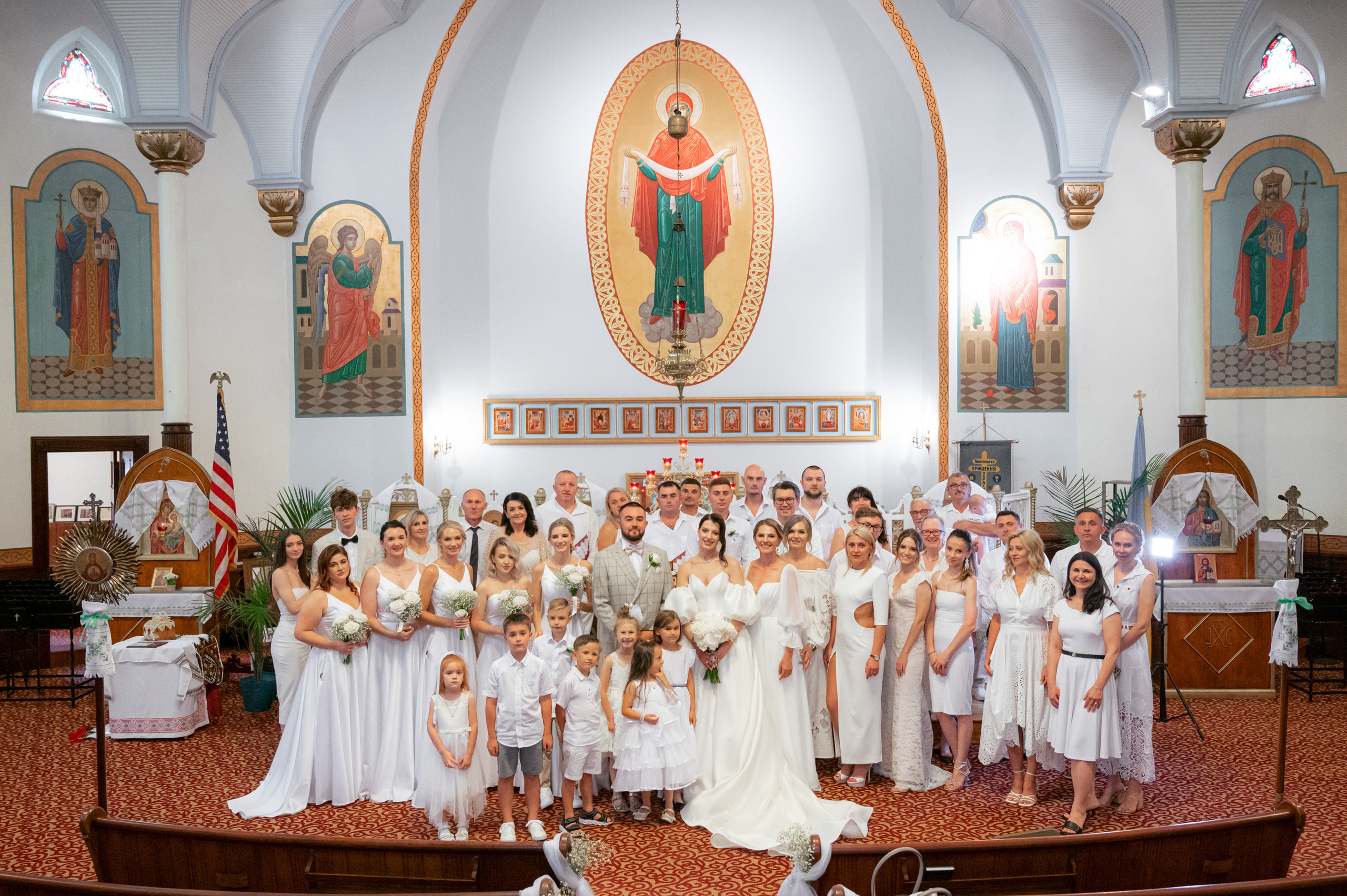 a group of people standing in a church