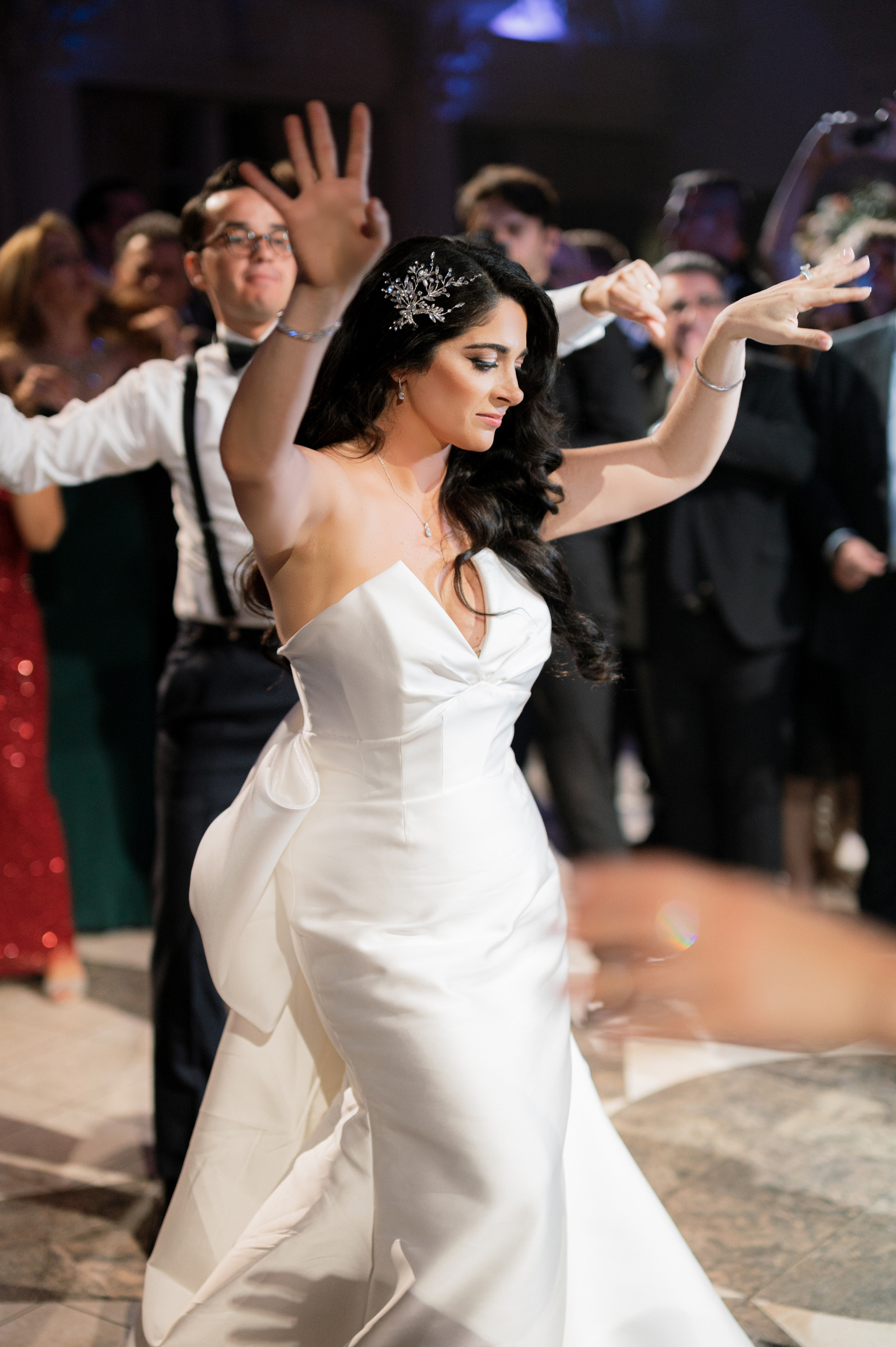 a woman in a white dress is dancing