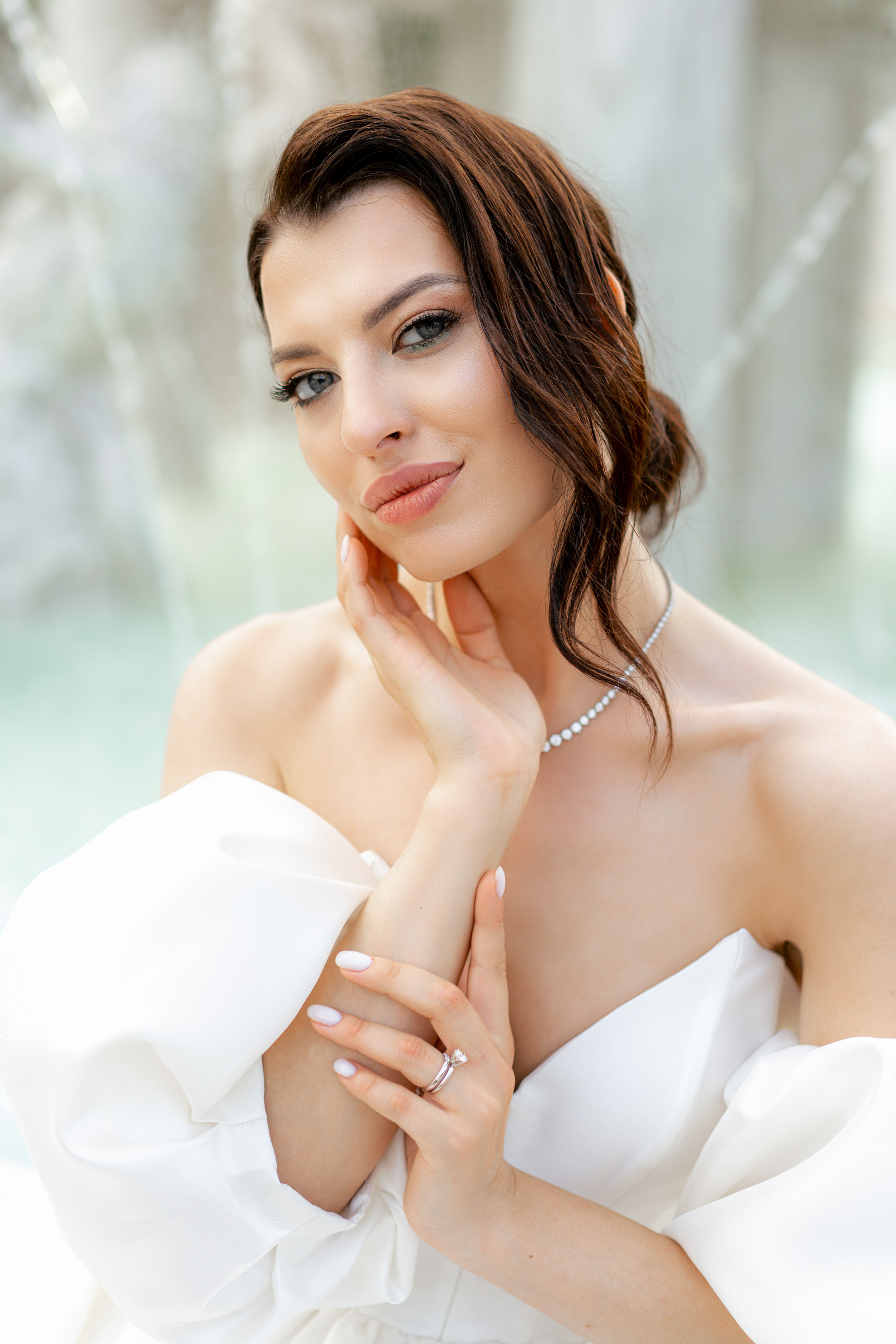 a woman in a white dress posing for a photo