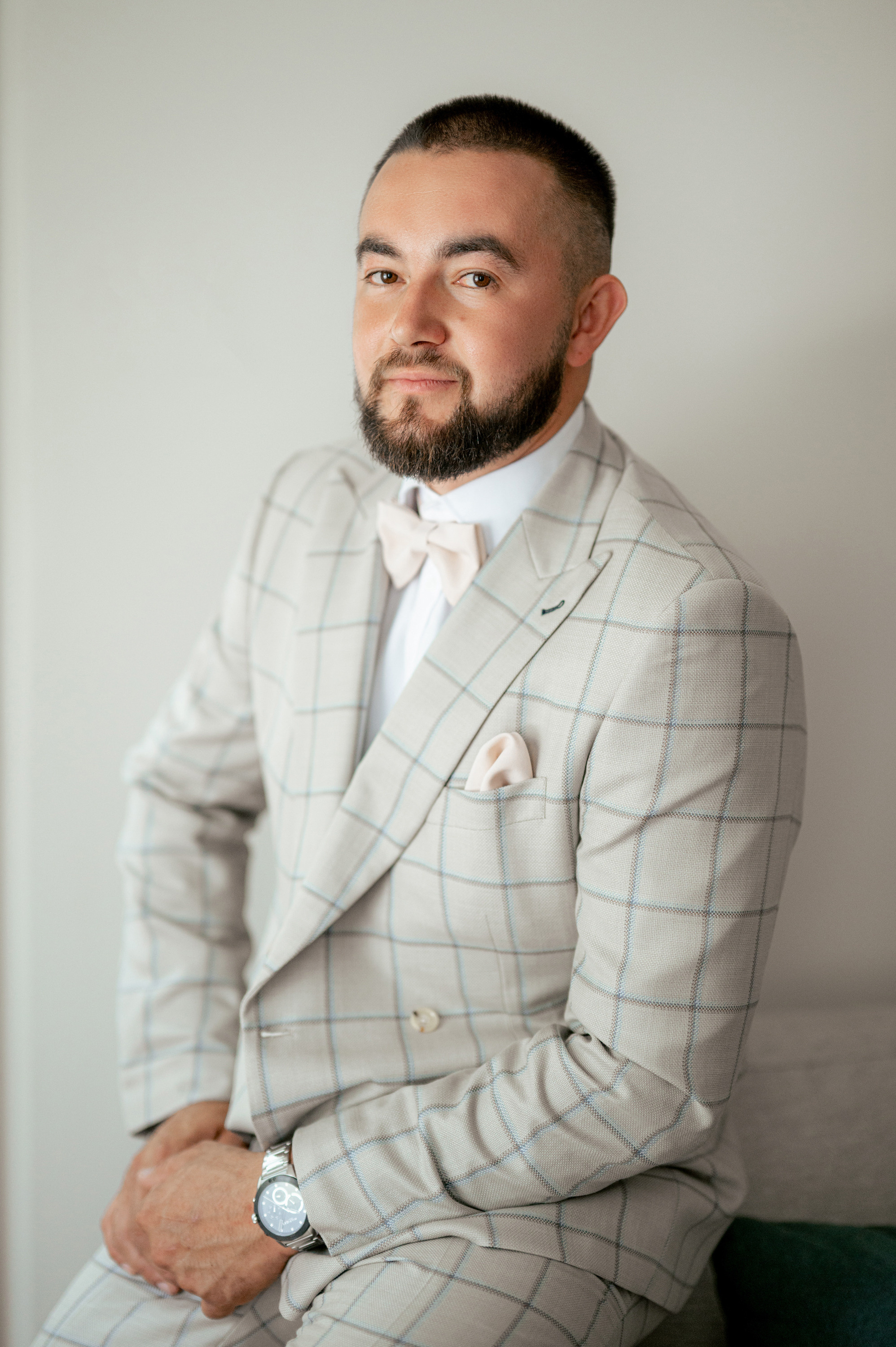 a man with a beard and a suit