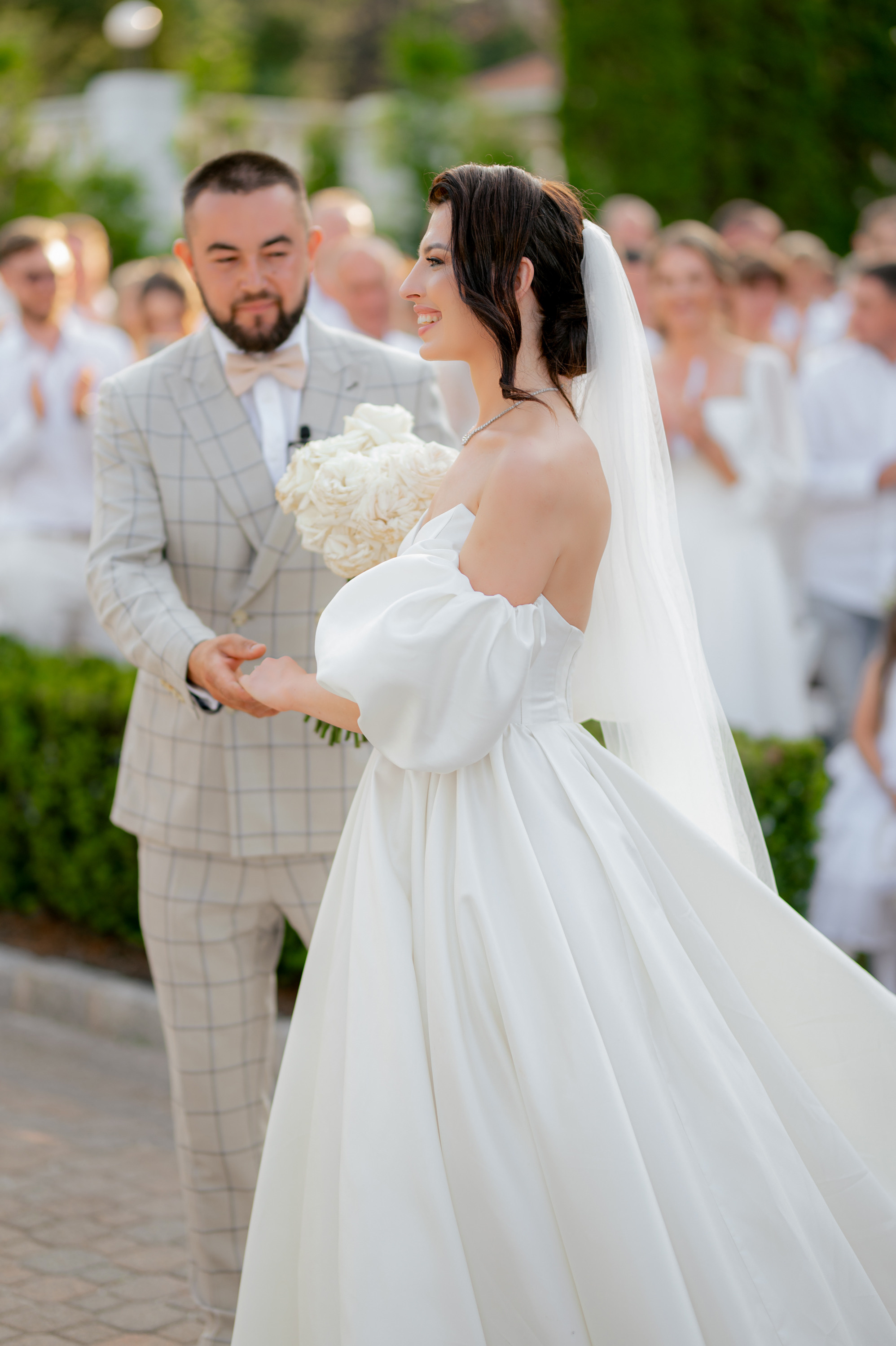 a bride and groom walking down the aisle