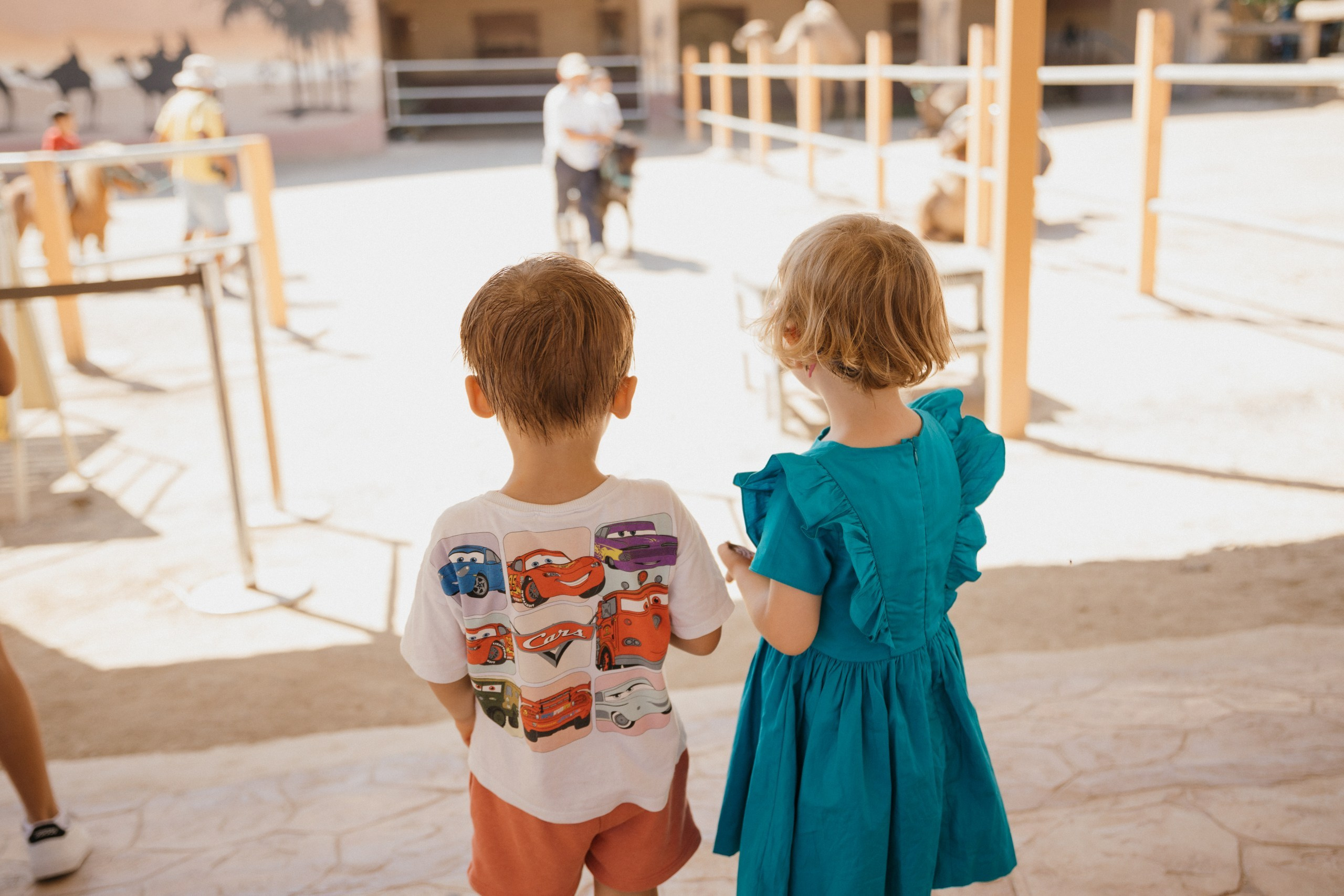 Joyful Moments in Camel park: Olya and Ada’s Day of Fun and Adventure, sliding and riding camels. Photographer in Barcelona capturing unique stories | Kate Chumak