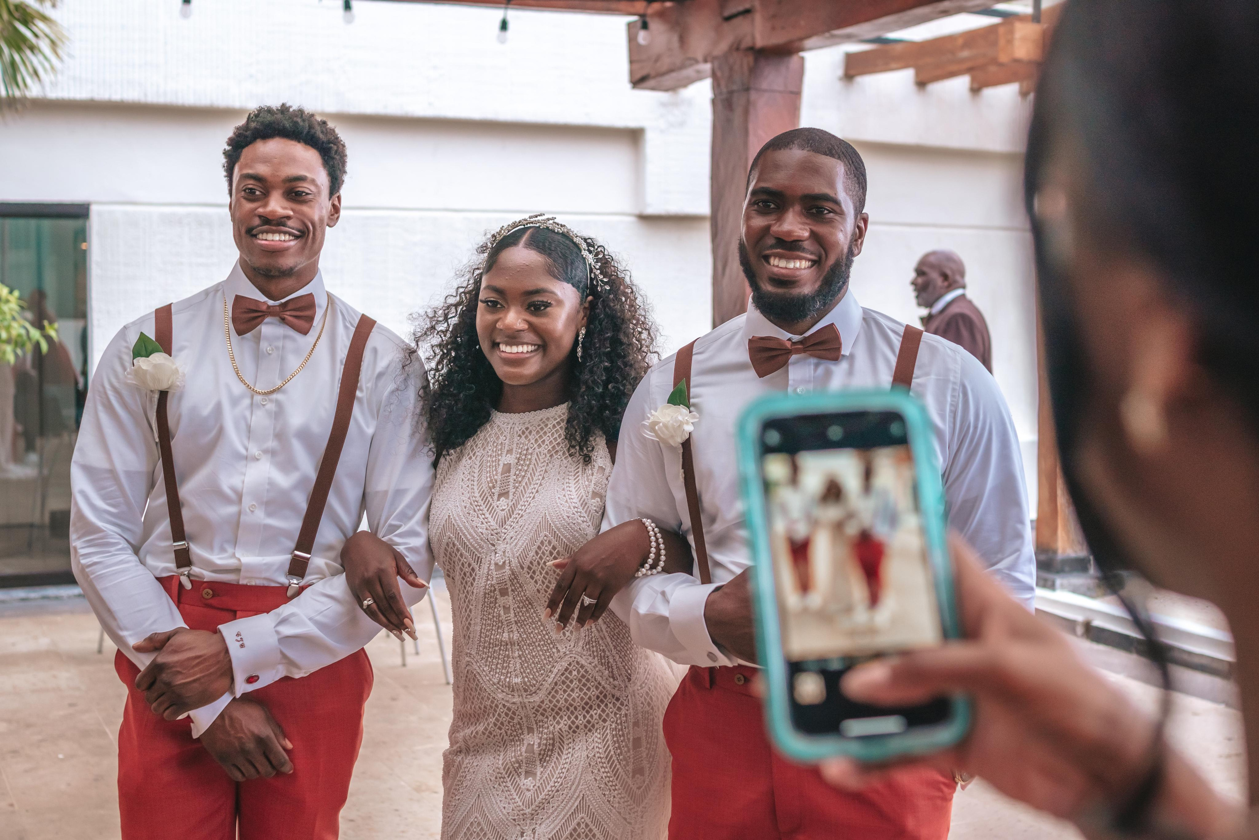 Smiling wedding guests posing before the ceremony – candid photo by luxury wedding photographer in Cancun, Riviera Maya