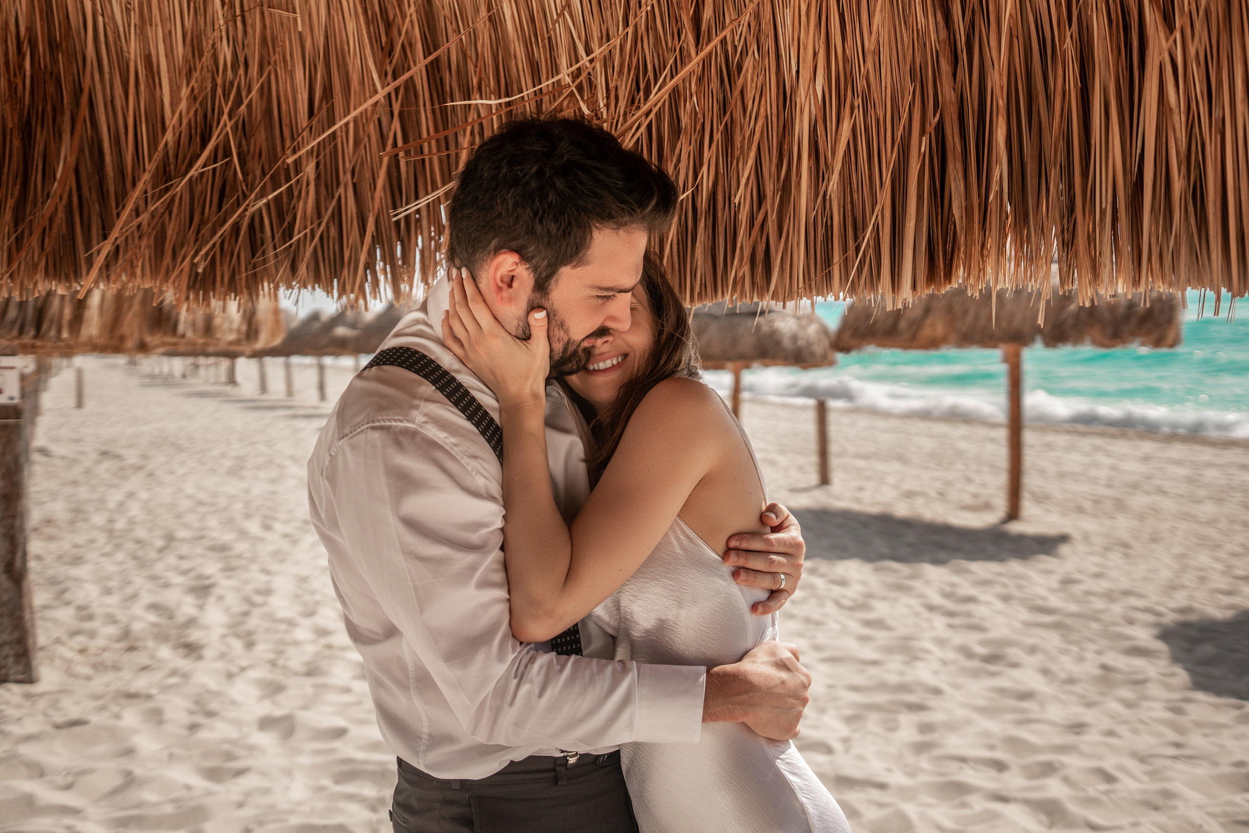 Passionate seaside moment for engaged couple