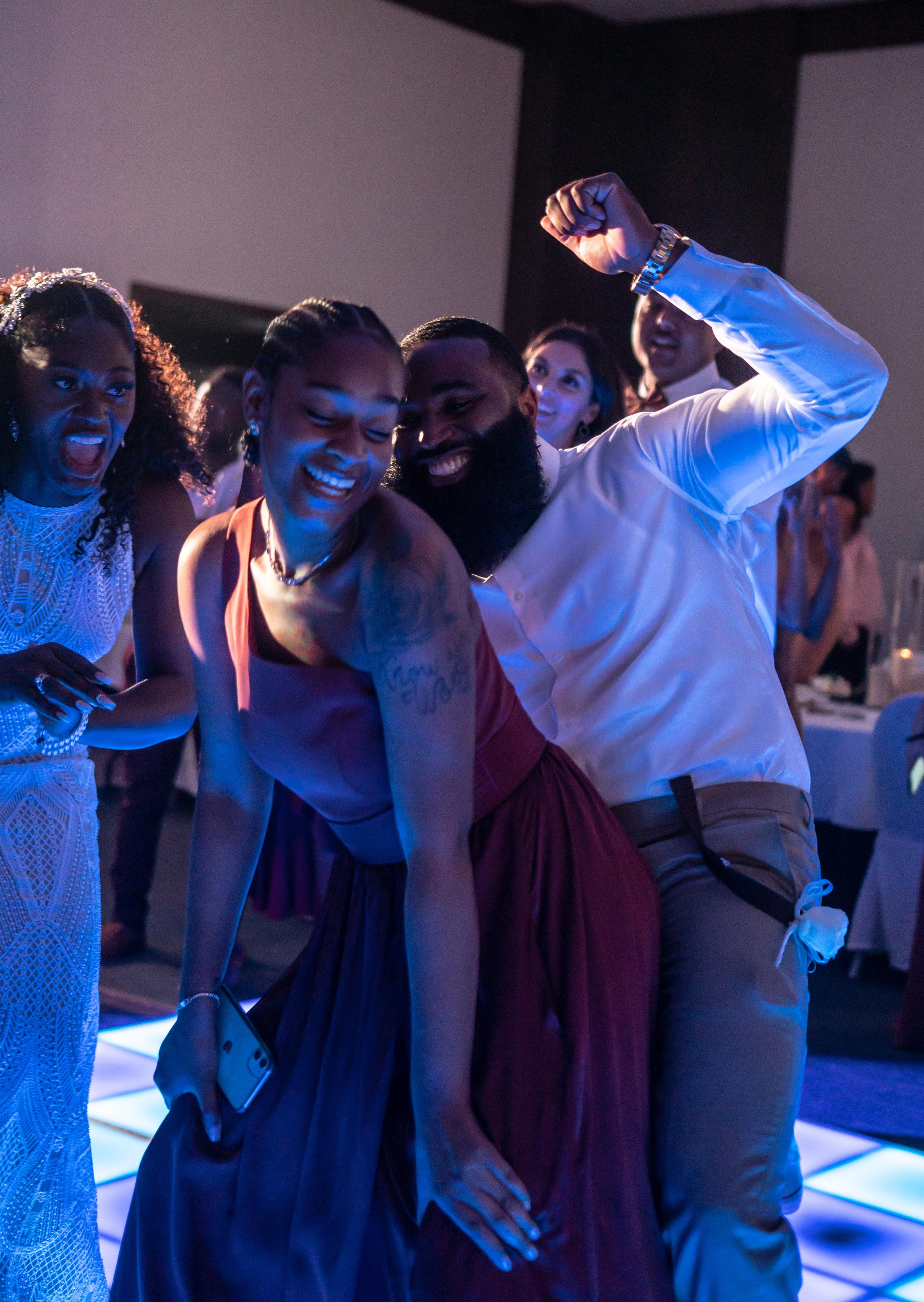 Tropical wedding night vibes with vibrant blue and purple lights