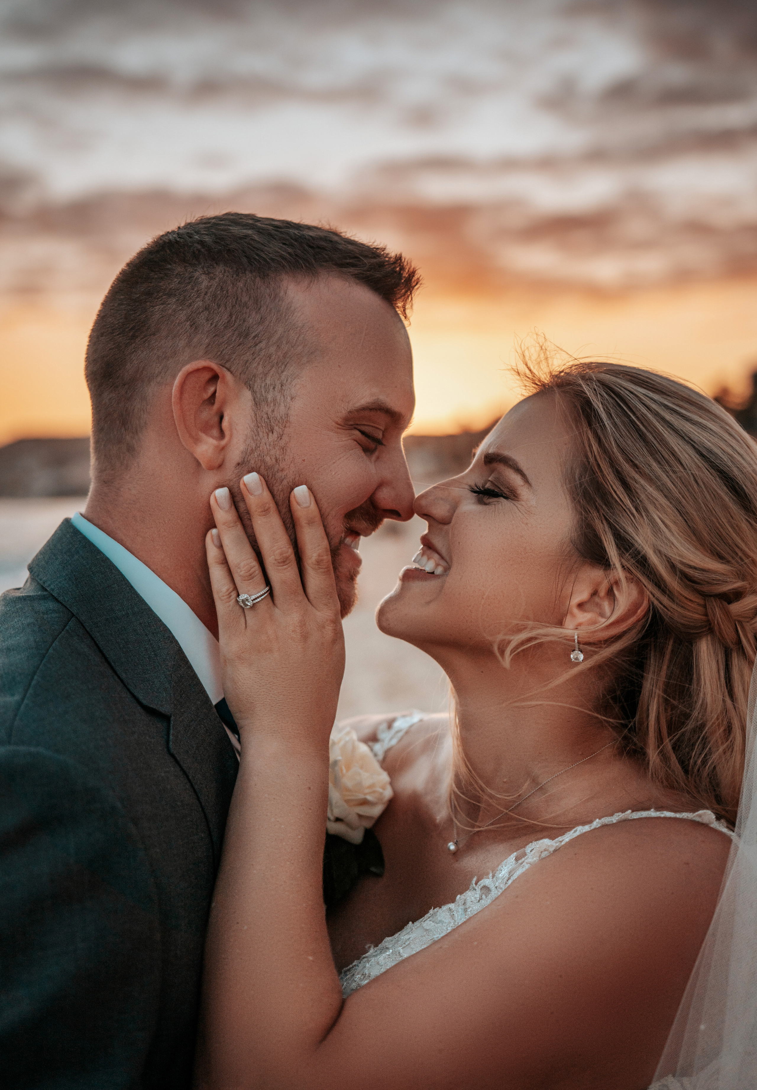 Wedding portrait on the sand with stunning Baja California sunset backdrop