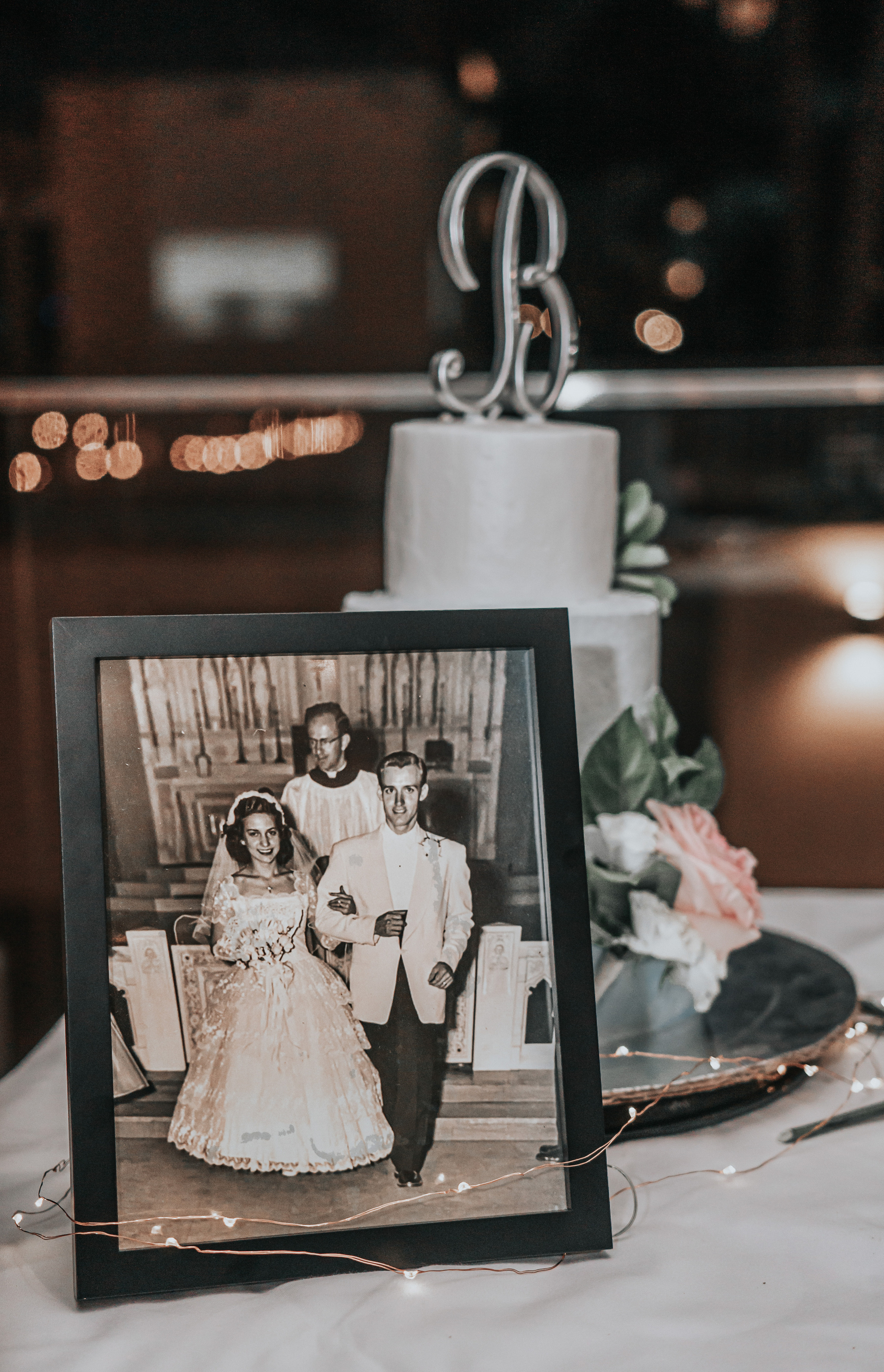 Destination wedding cake with white florals photographed in Mexico