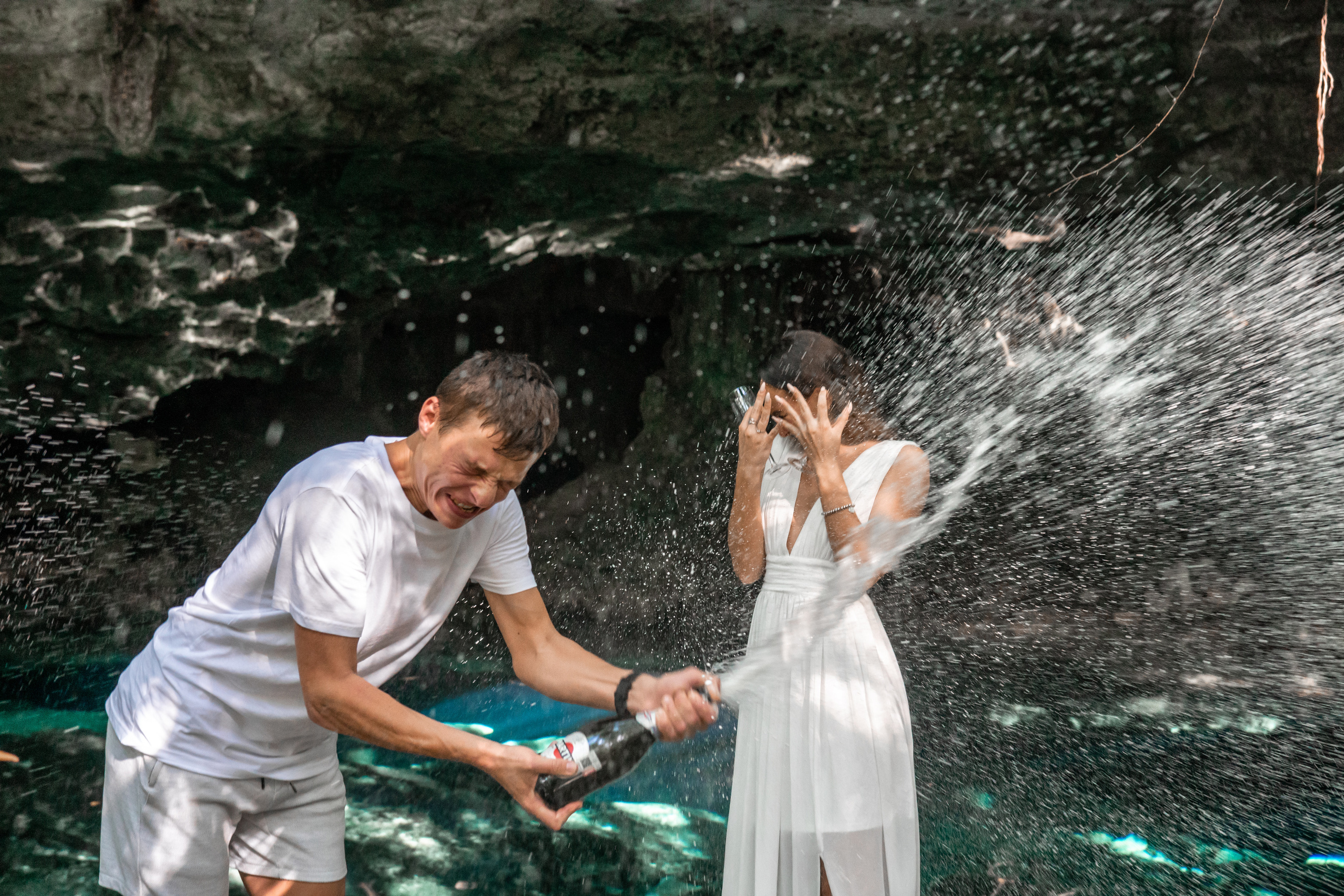 Bride-to-be receiving proposal in magical cenote