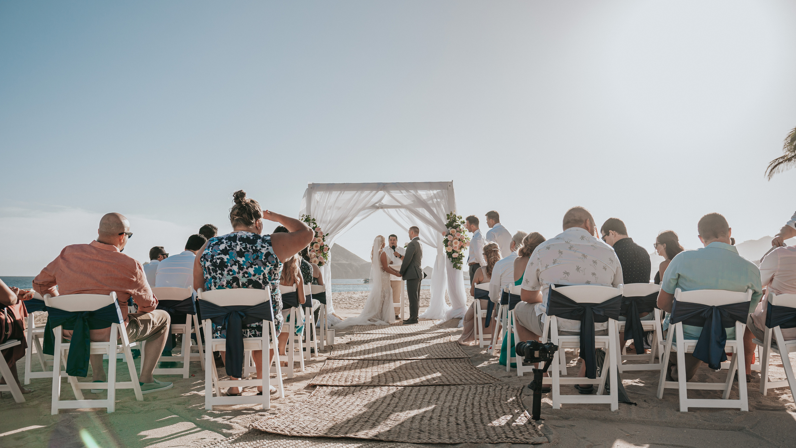 Cabo wedding photographer capturing ceremony by the cliffs
