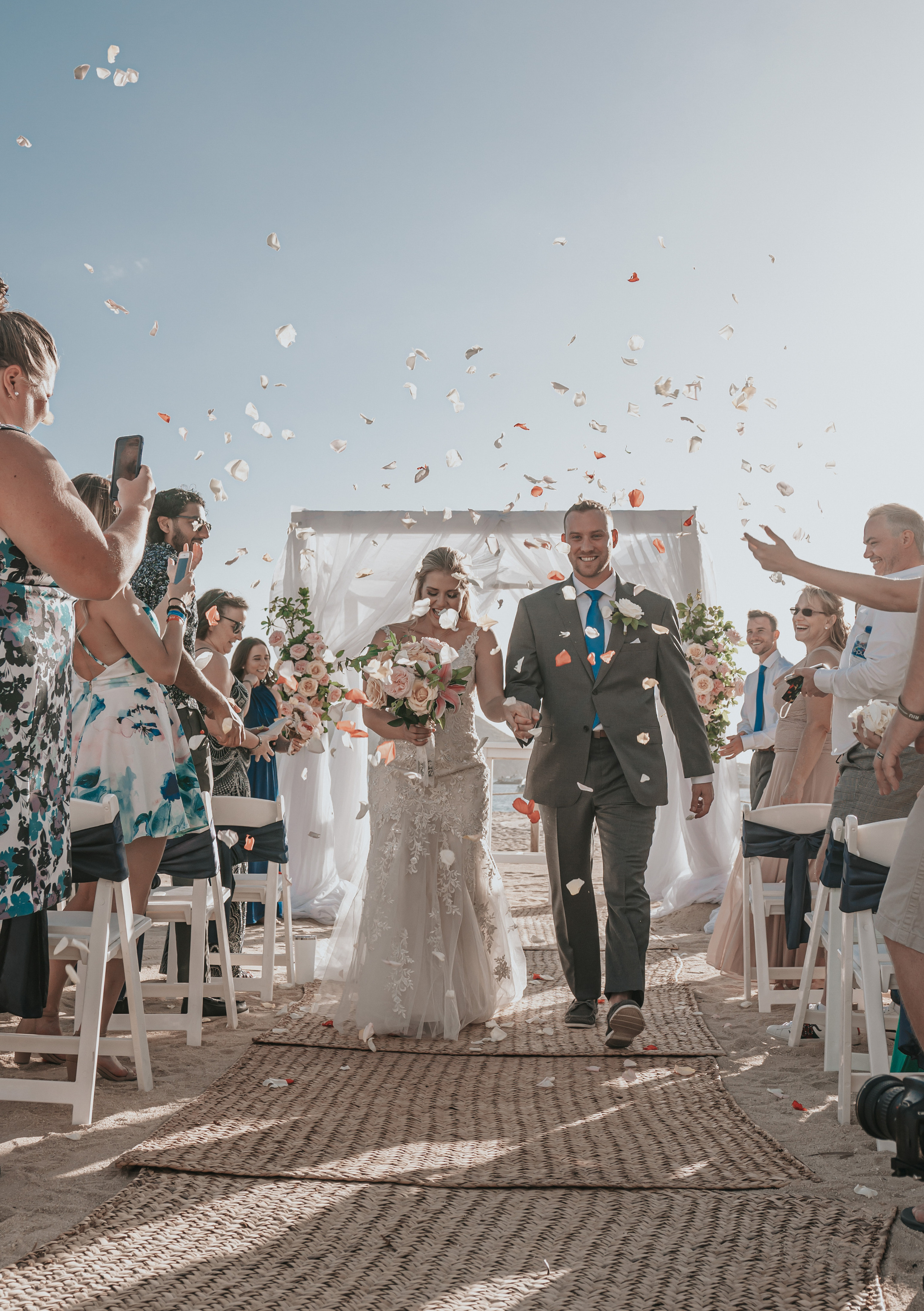 Elegant couple photographed during Cabo ceremony by sea