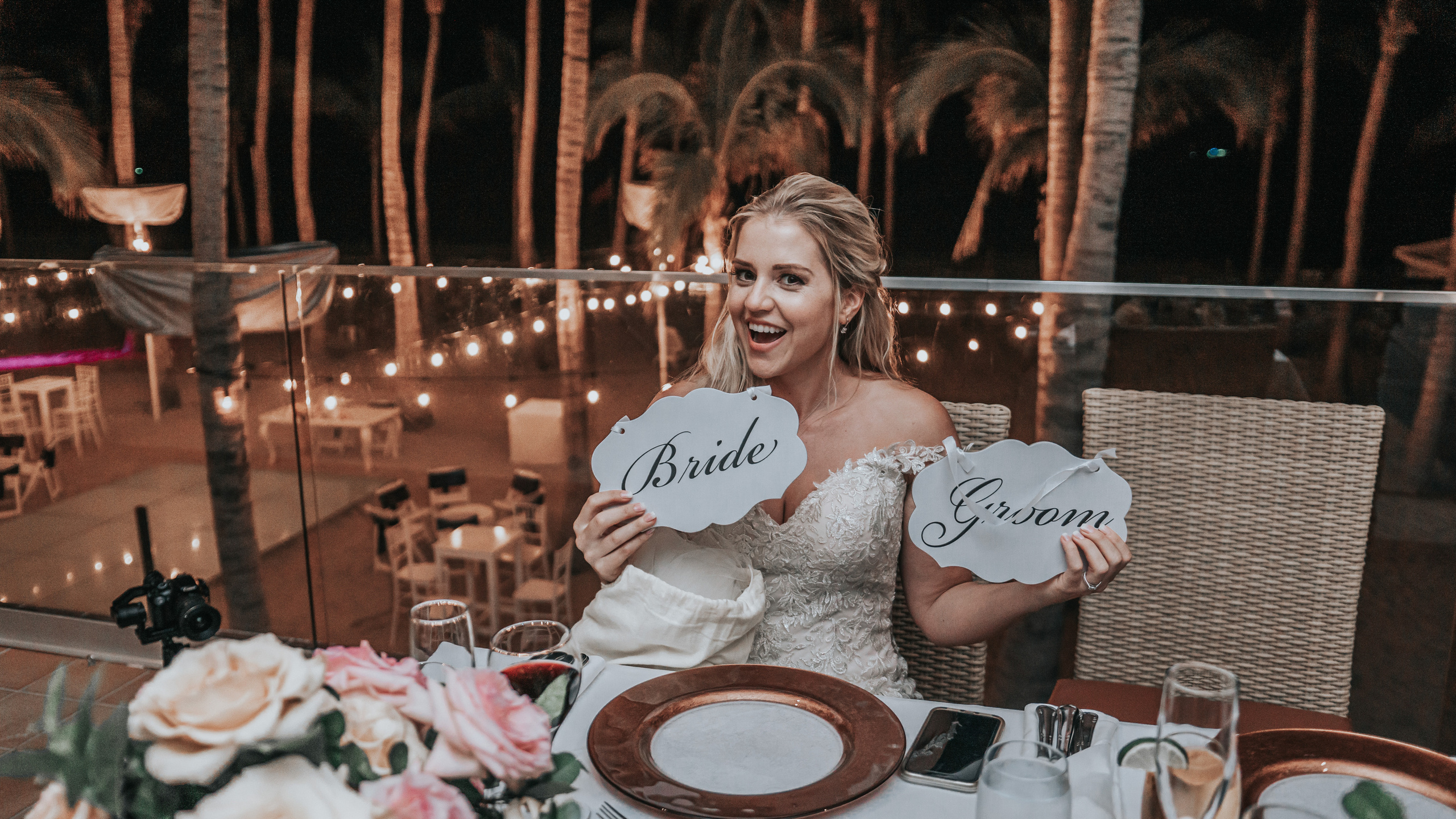 Playful moment of bride at beachside wedding venue in Los Cabos, Mexico