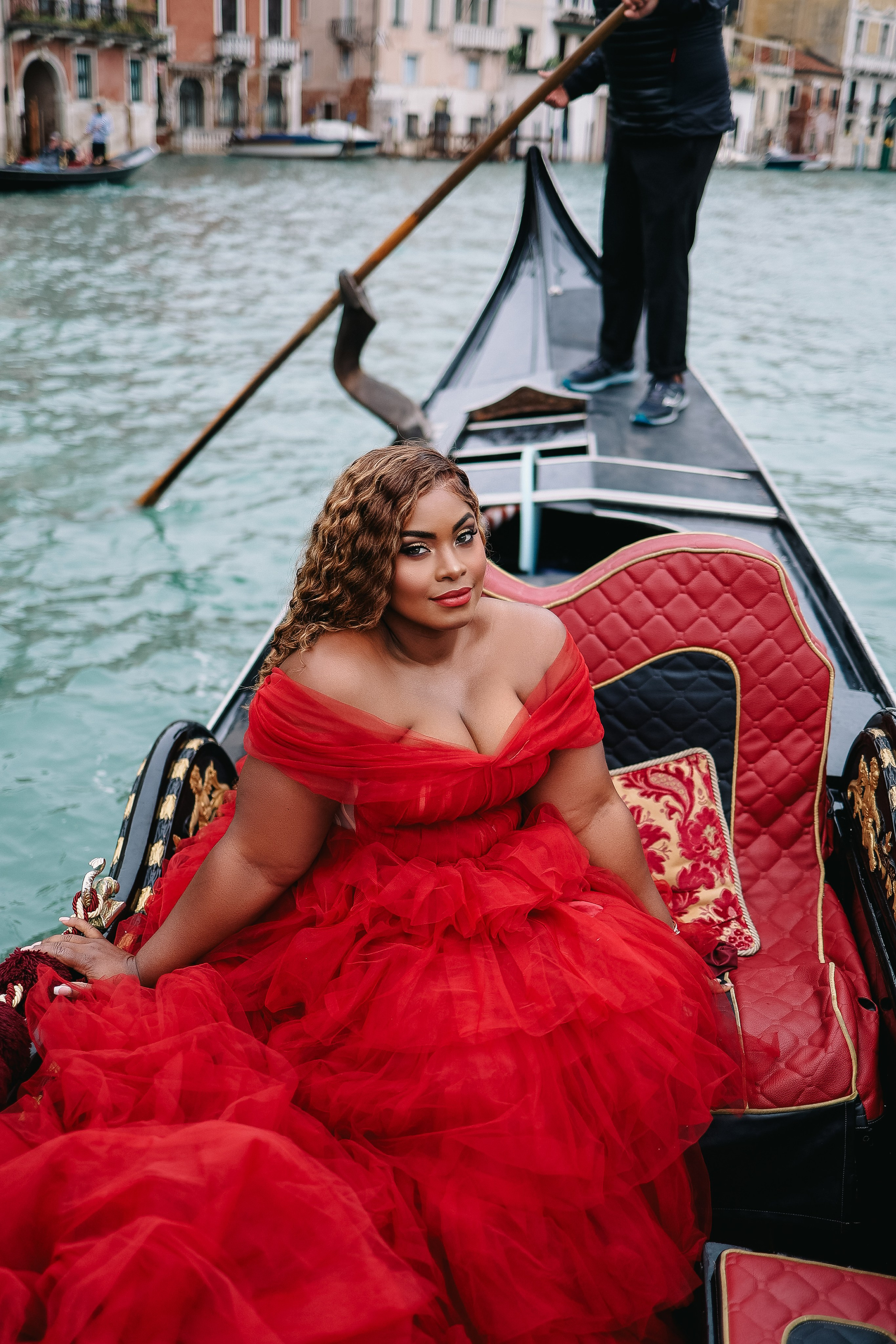 Rihanna in a red dress