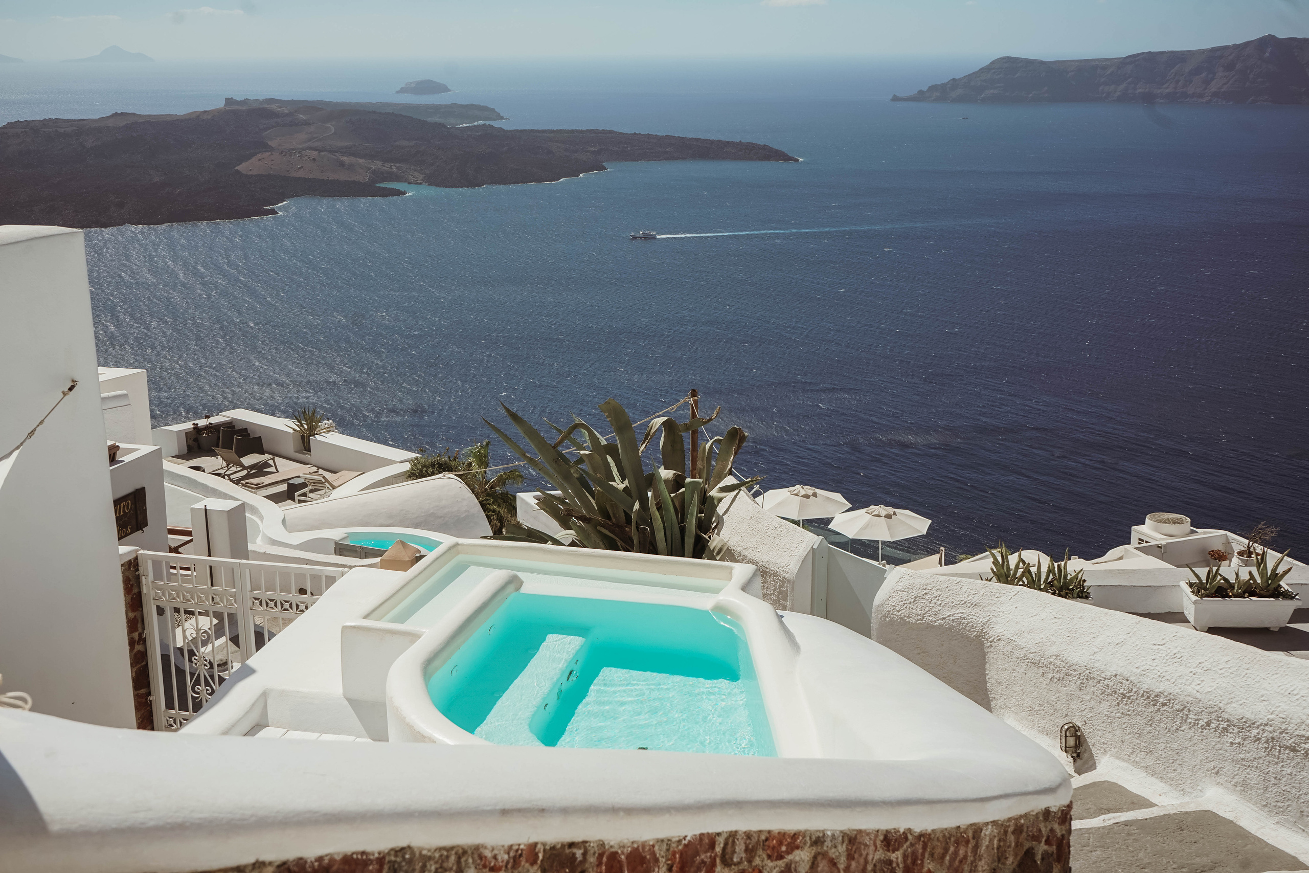 sunbathing in the pool overlooking the sea