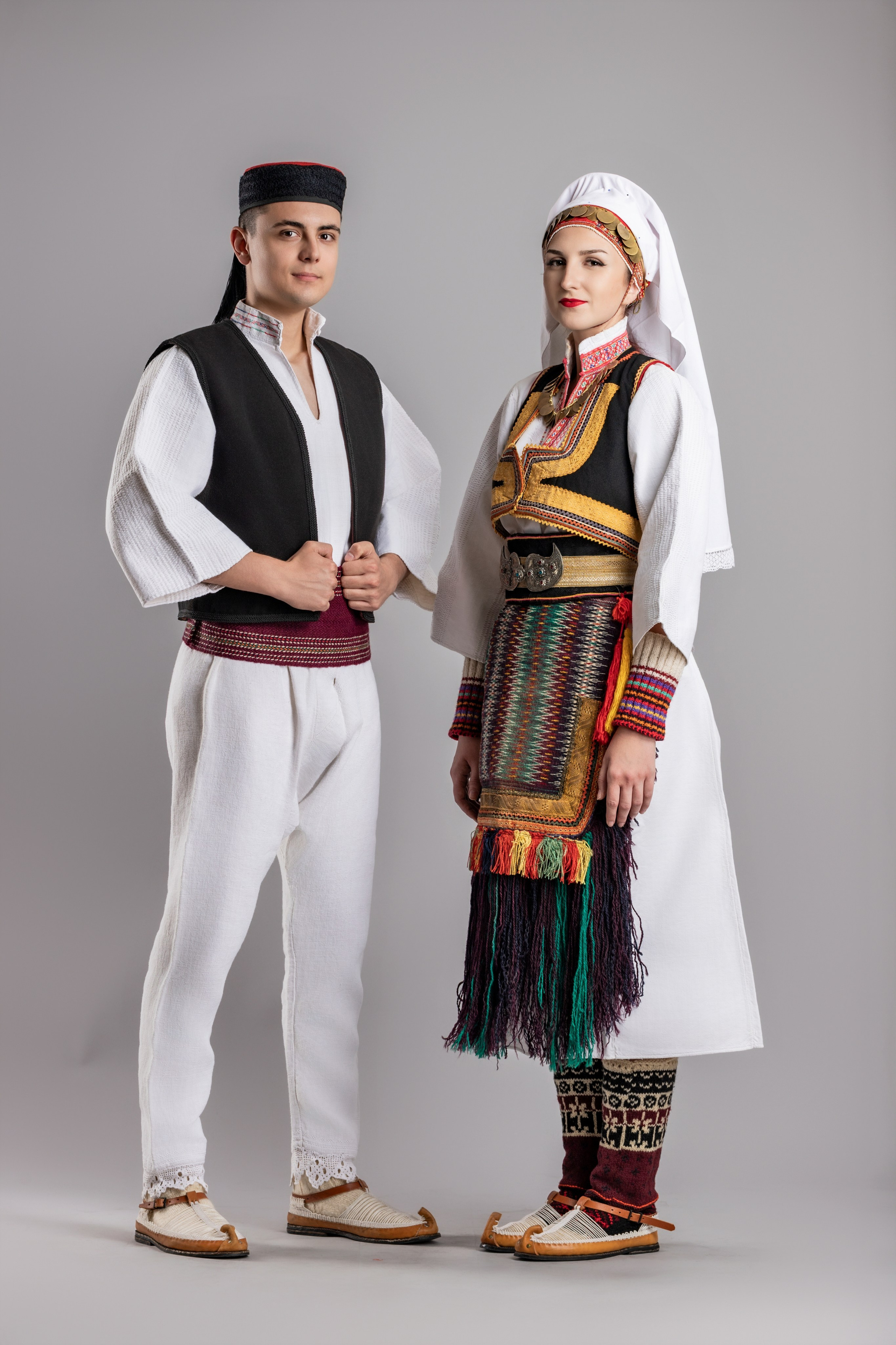 Studio portrait photography of traditional folk costumes from Bosnia and Herzegovina featuring authentic cultural clothing, embroidery, jewelry and handcrafted garments, photographed by Namir Čomaga. The images highlight the richness, craftsmanship and cultural heritage of Bosnian traditional costumes through carefully lit studio portraits.