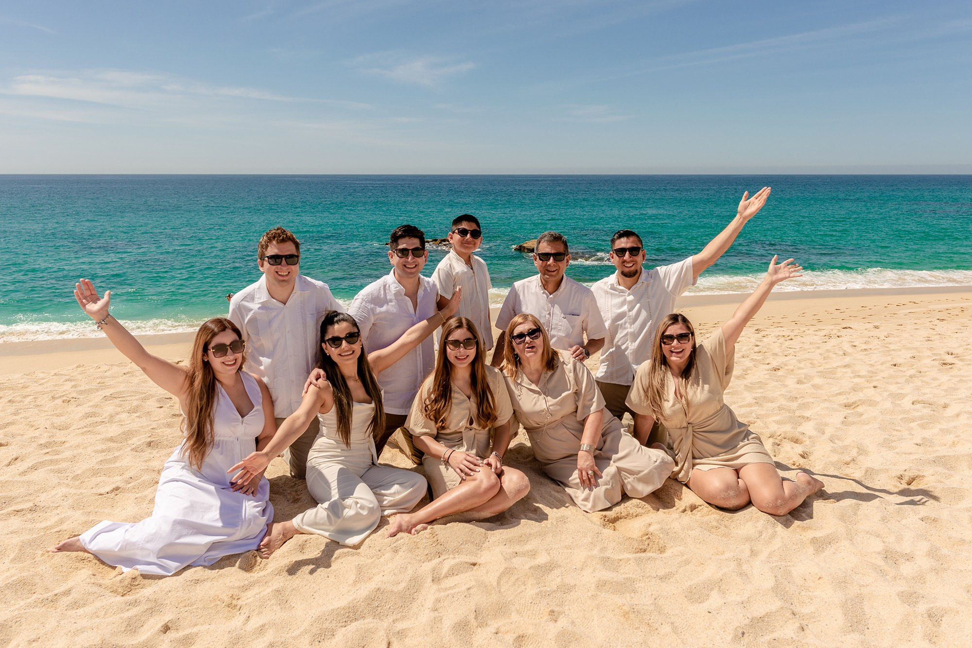 Extended family session in San Jose del Cabo – group portrait at Cabo Surf Hotel celebrating together by the ocean