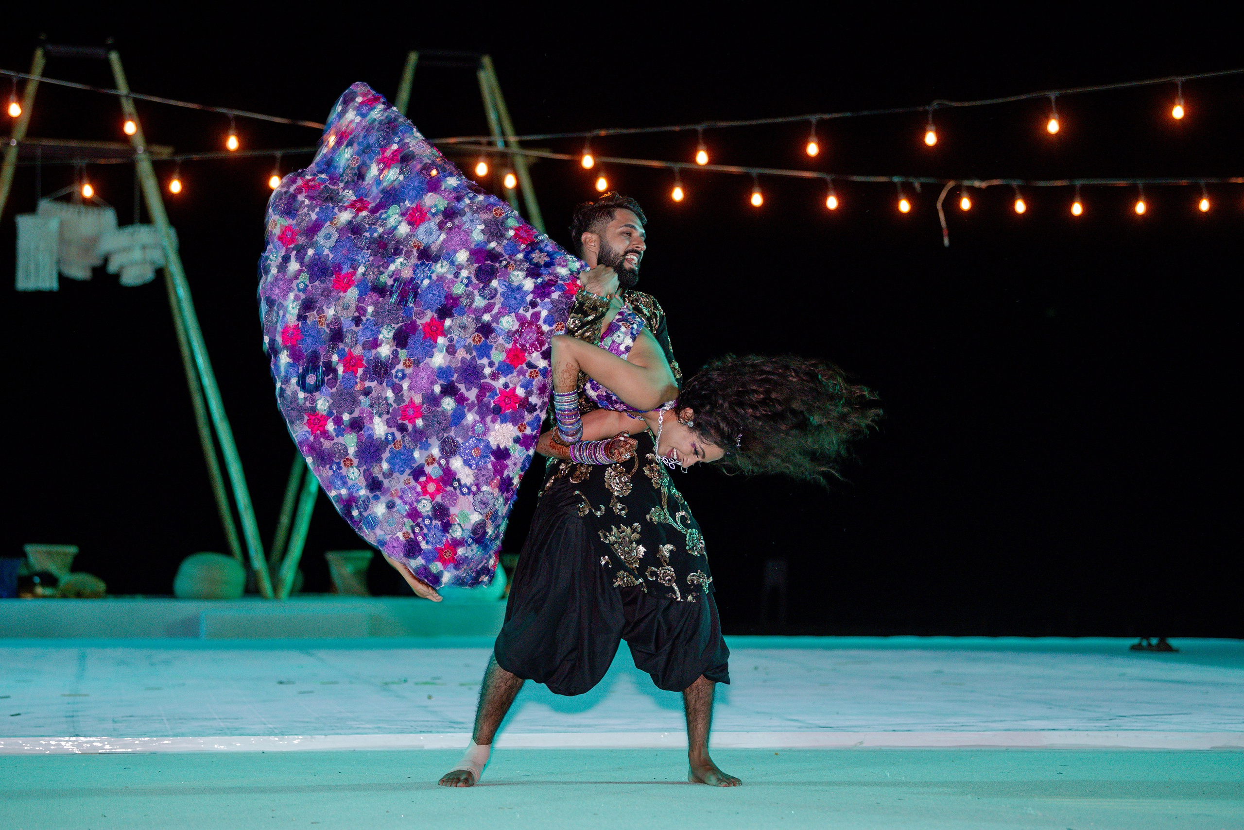 Indian wedding in Los Cabos – bride lifted in celebration at Paradisus Resort, vibrant multi day destination wedding