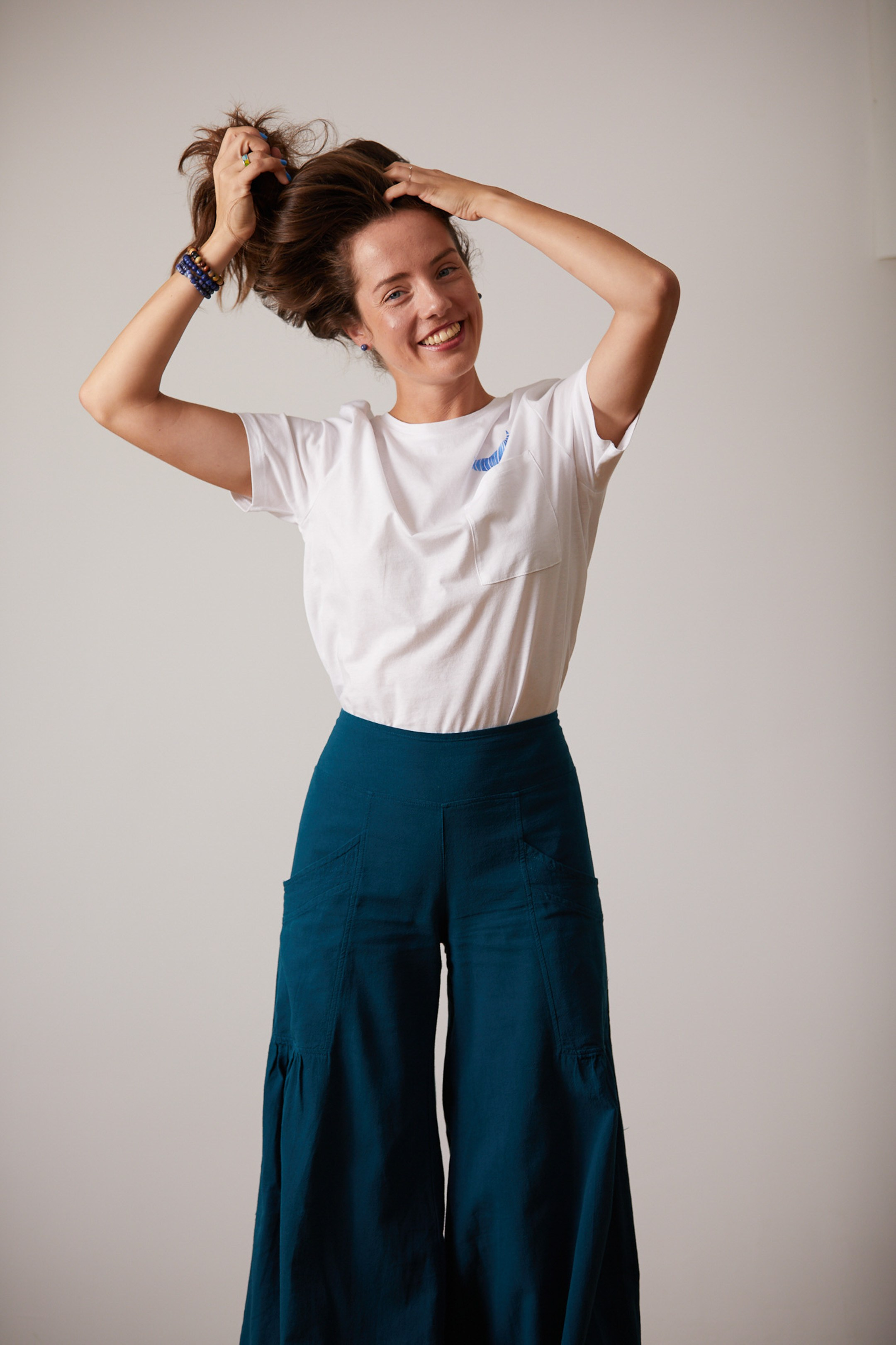 Emotional portrait of a young lady on a white studio background - - photographer Andrey Dunin