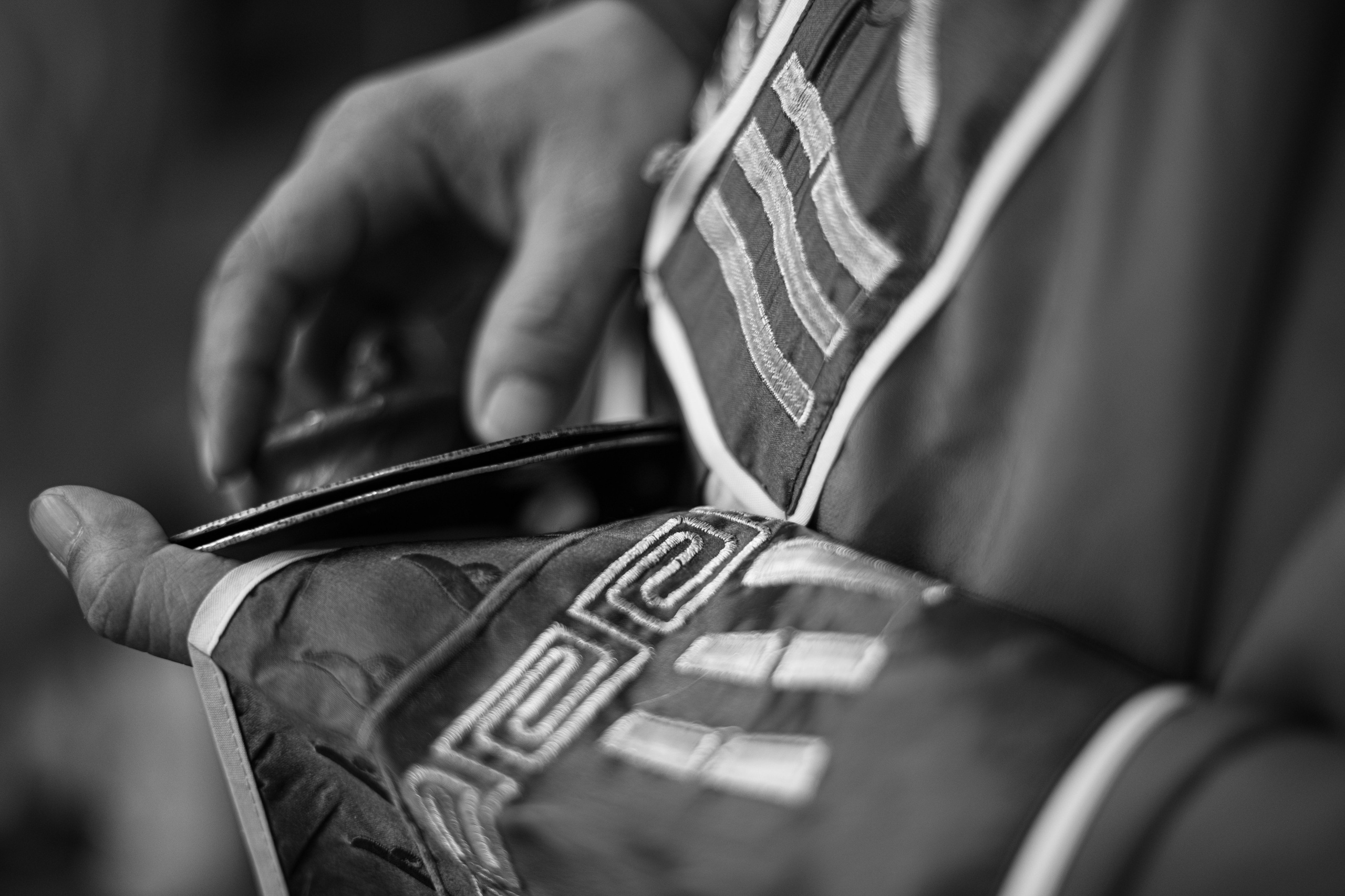 A captivating black-and-white photograph capturing a group of devotees in prayer during the Thaipusam festival in Singapore. The unified gestures and serene expressions convey a deep sense of faith and community. This image exemplifies the photographer’s ability to document powerful moments with authenticity and emotional depth, making it ideal for clients seeking expert reportage and storytelling for cultural and religious events.