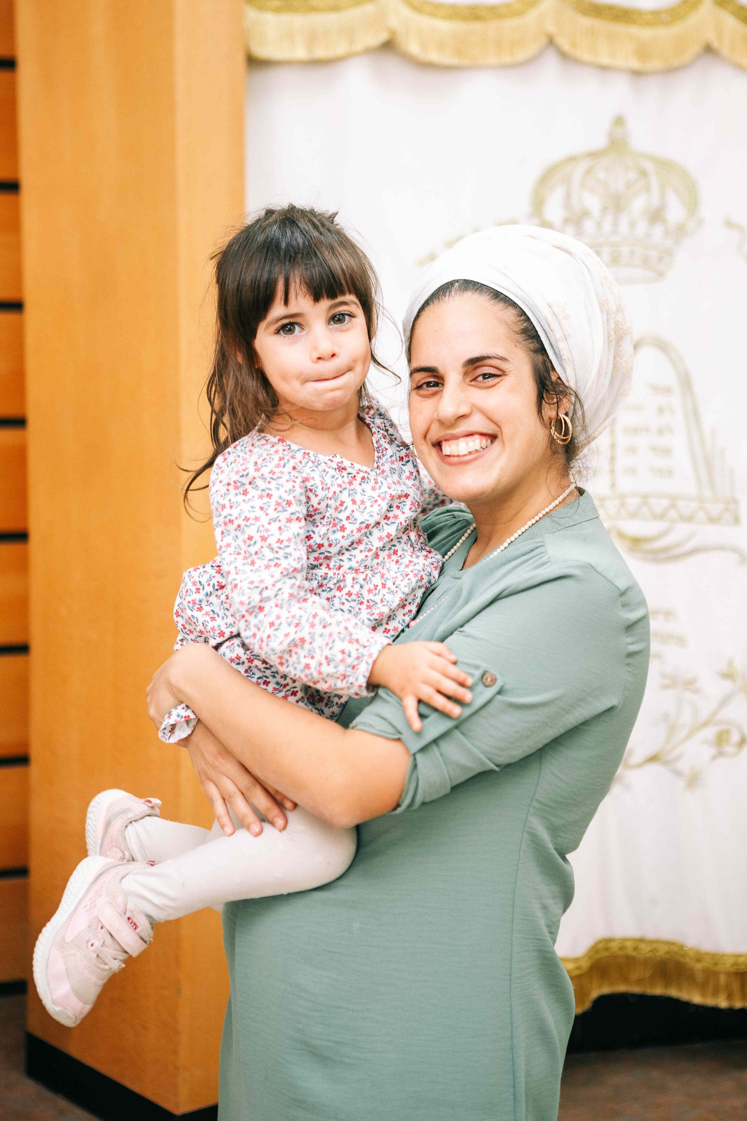 BRITH MILA IN THE SMALL SYNAGOGUE. PHOTOGRAPHER IN ISRAEL