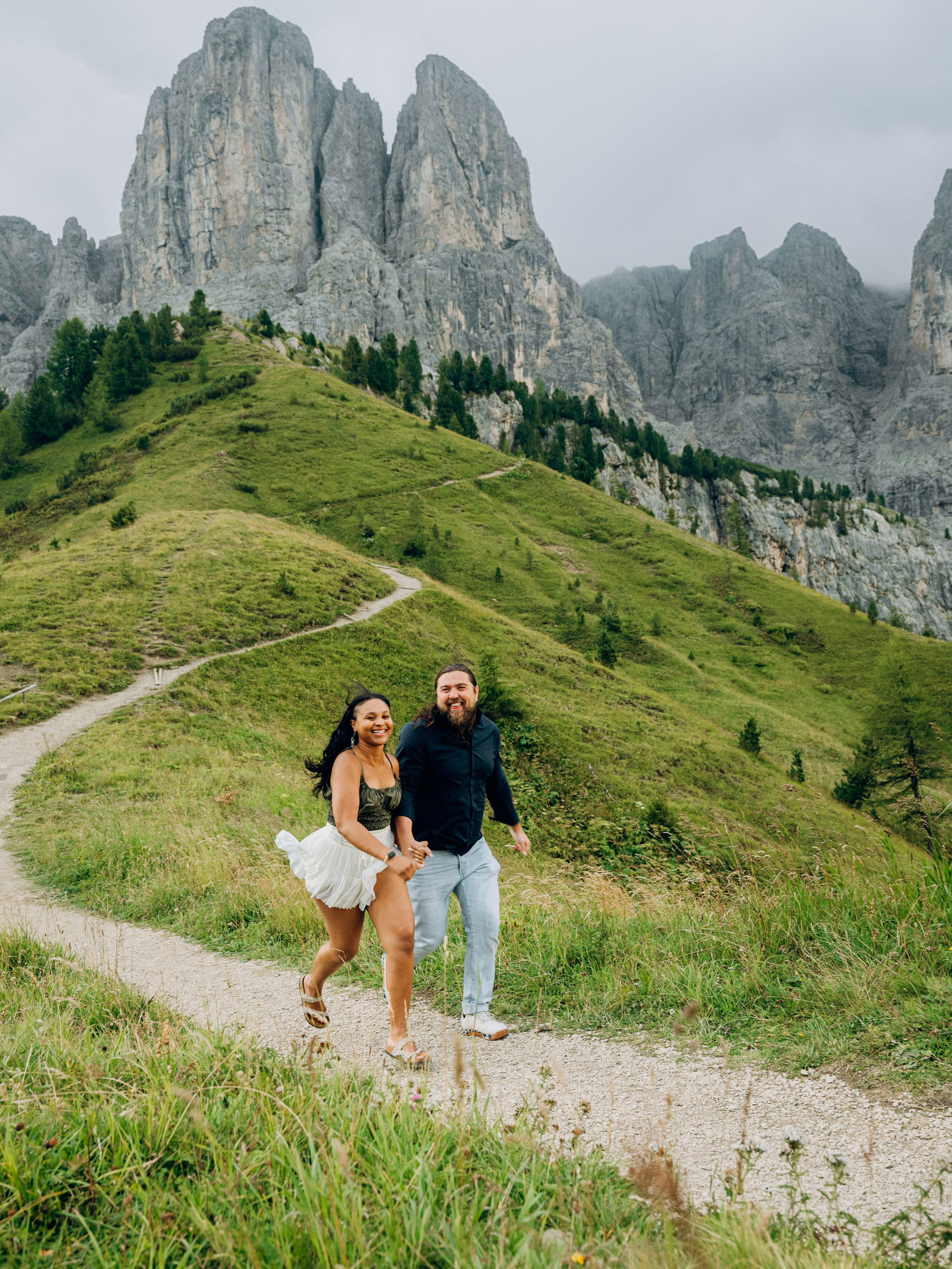 Wind catching dress during proposal photoshoot in the Dolomites and Val Gardena