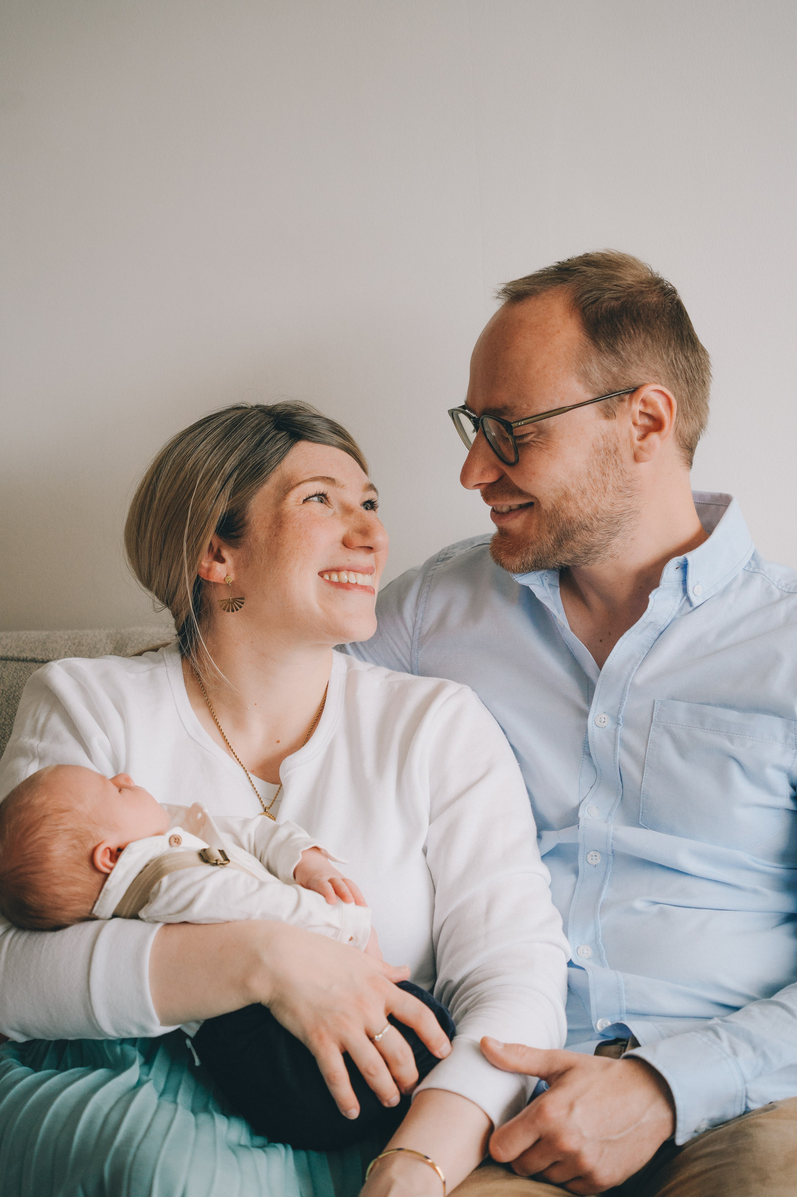 Natural family portraits with newborn baby at home in Solihull, full of joy and connection.