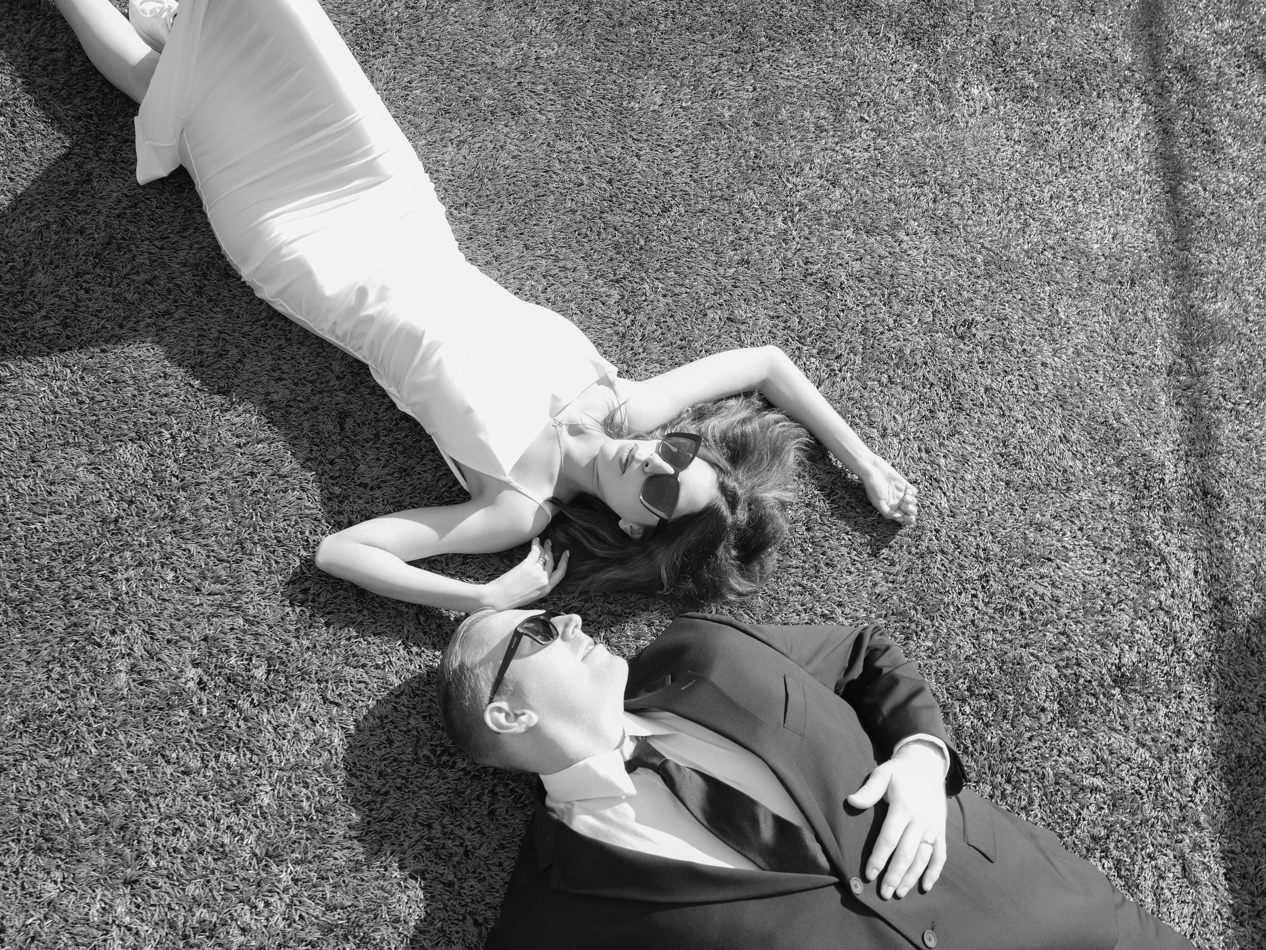 Couple laying at the football field during engagement photoshoot in Tbilisi 