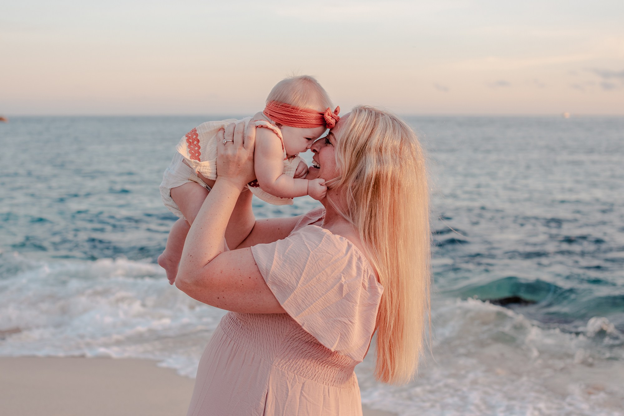 Mother and Son  enjoying golden hour, session on Playa Monumentos Cabo San Lucas  at sunset