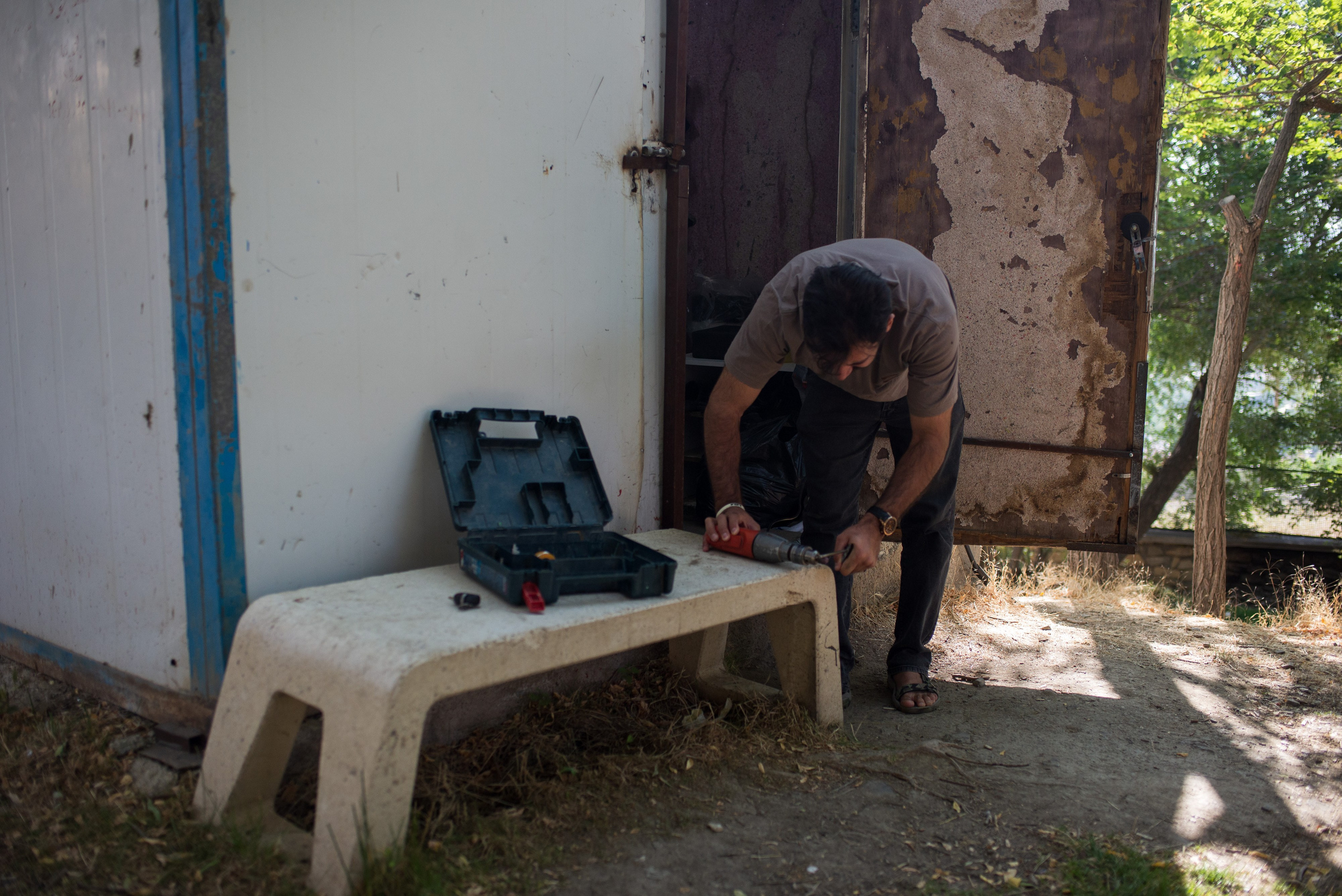Mohammad Valadi repairs and services one of the team’s kayaks.