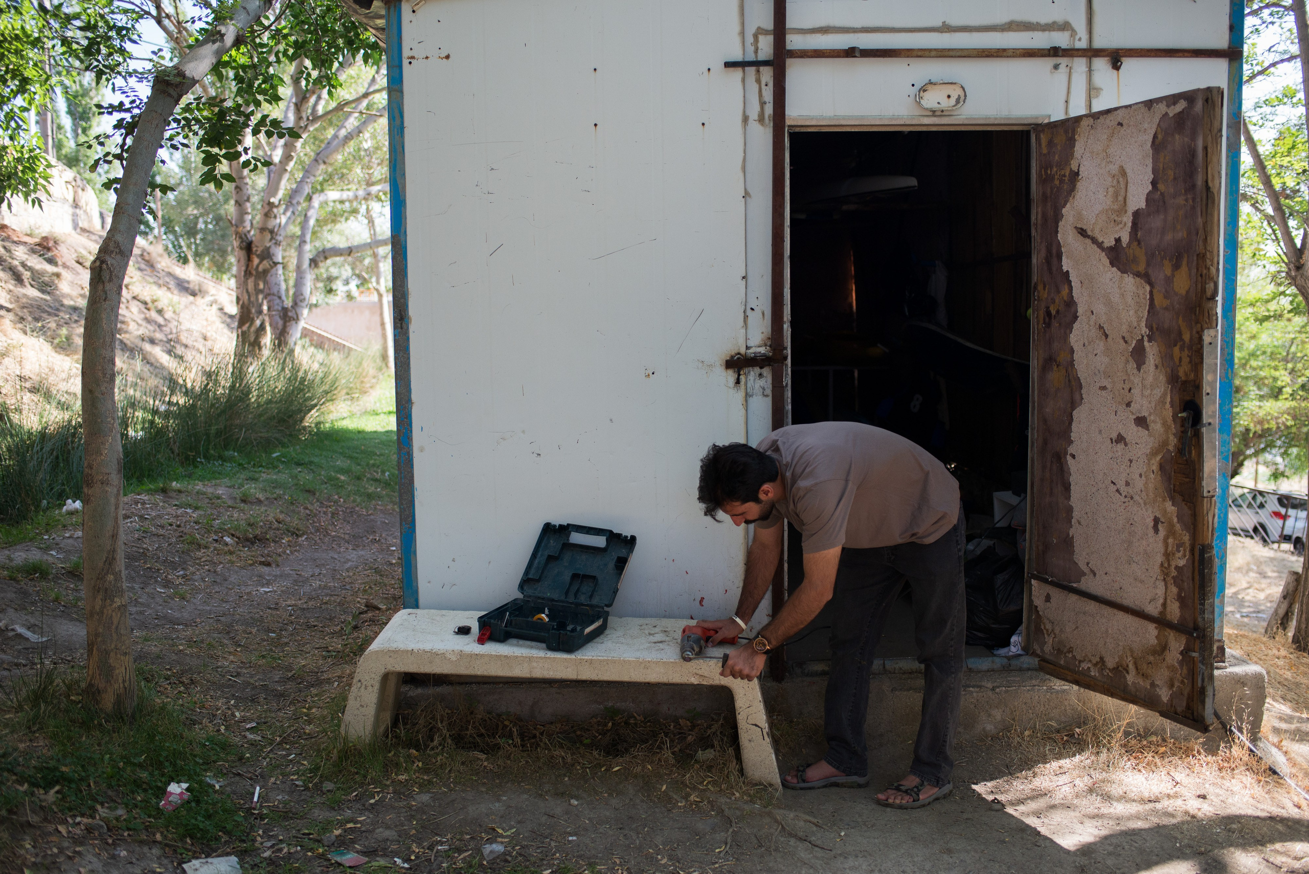 Repairing and preparing the kayaks is part of Mohammad Veldi’s routine work to keep the team training.