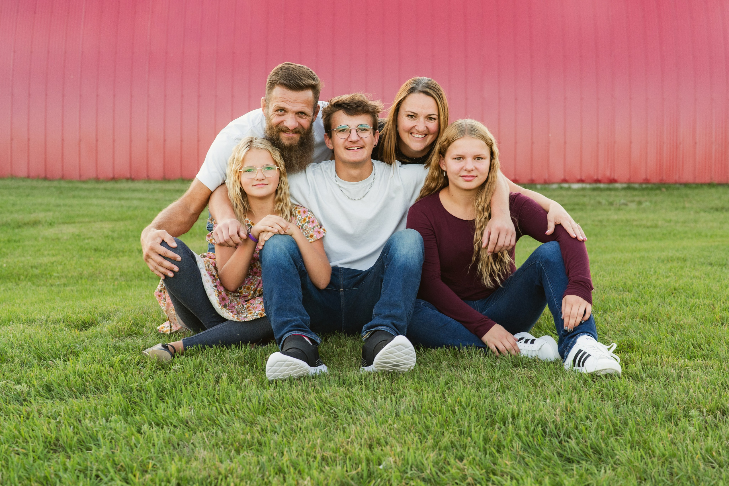 Family sitting on fallen leaves
