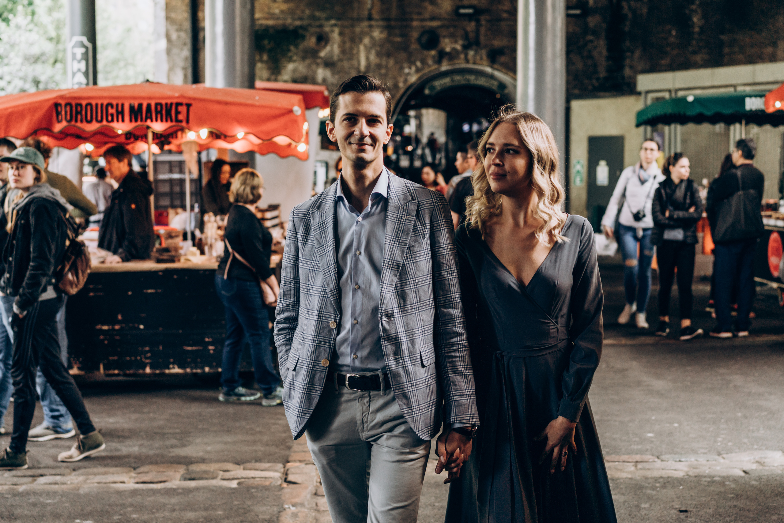 young couple walking through the market 