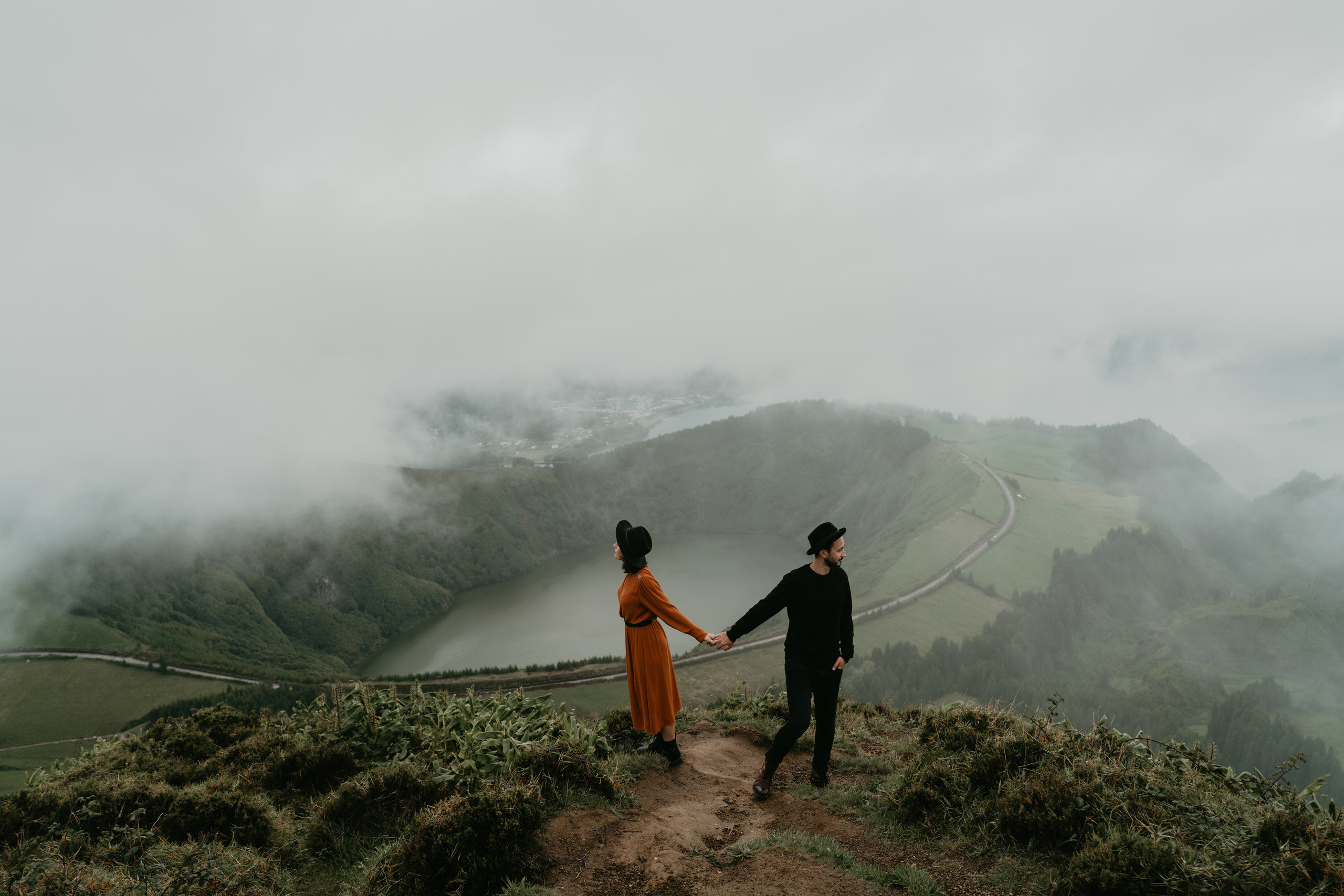 a couple is embracing over an abyss