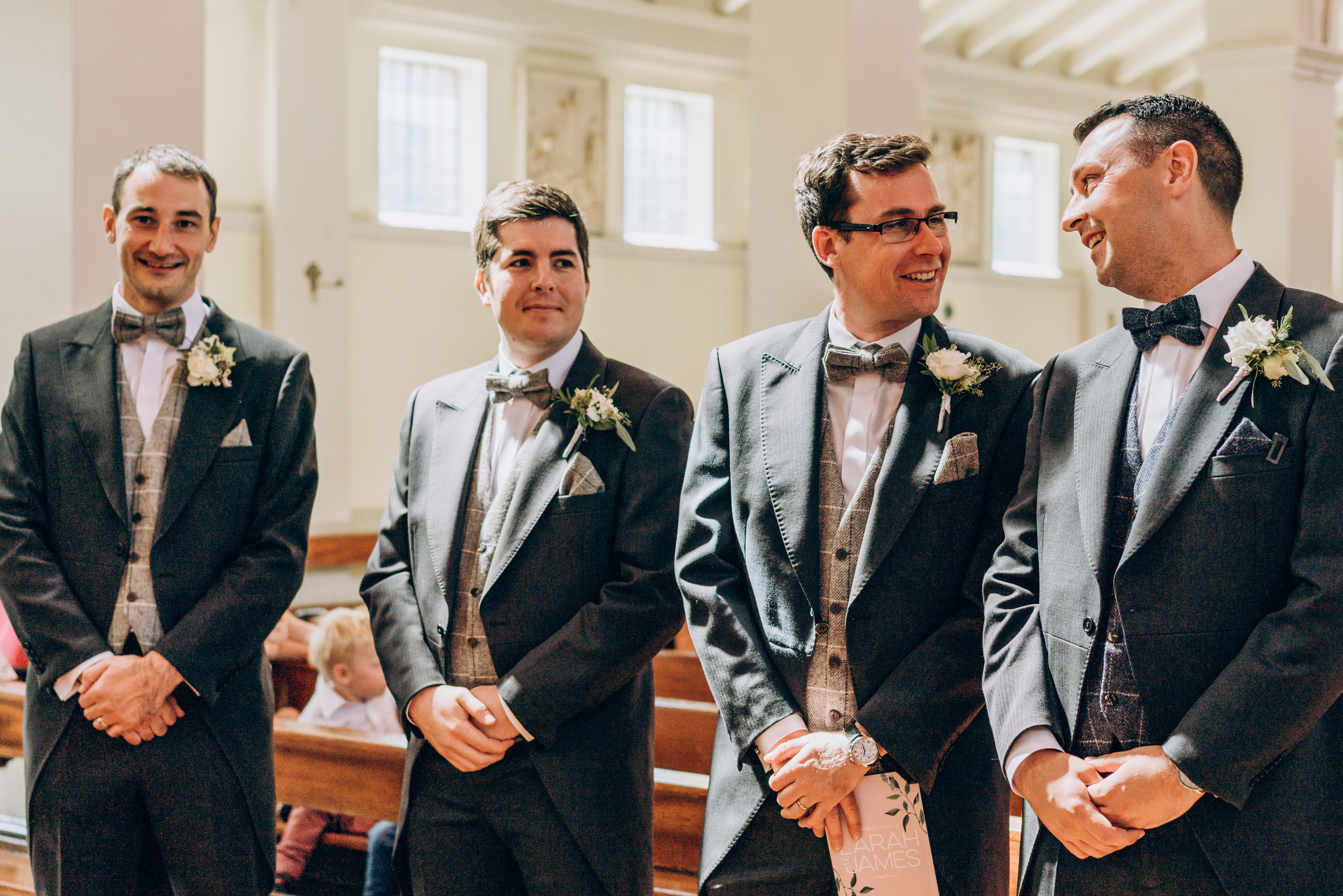 groom and groomsman are waiting bride arrival at church 