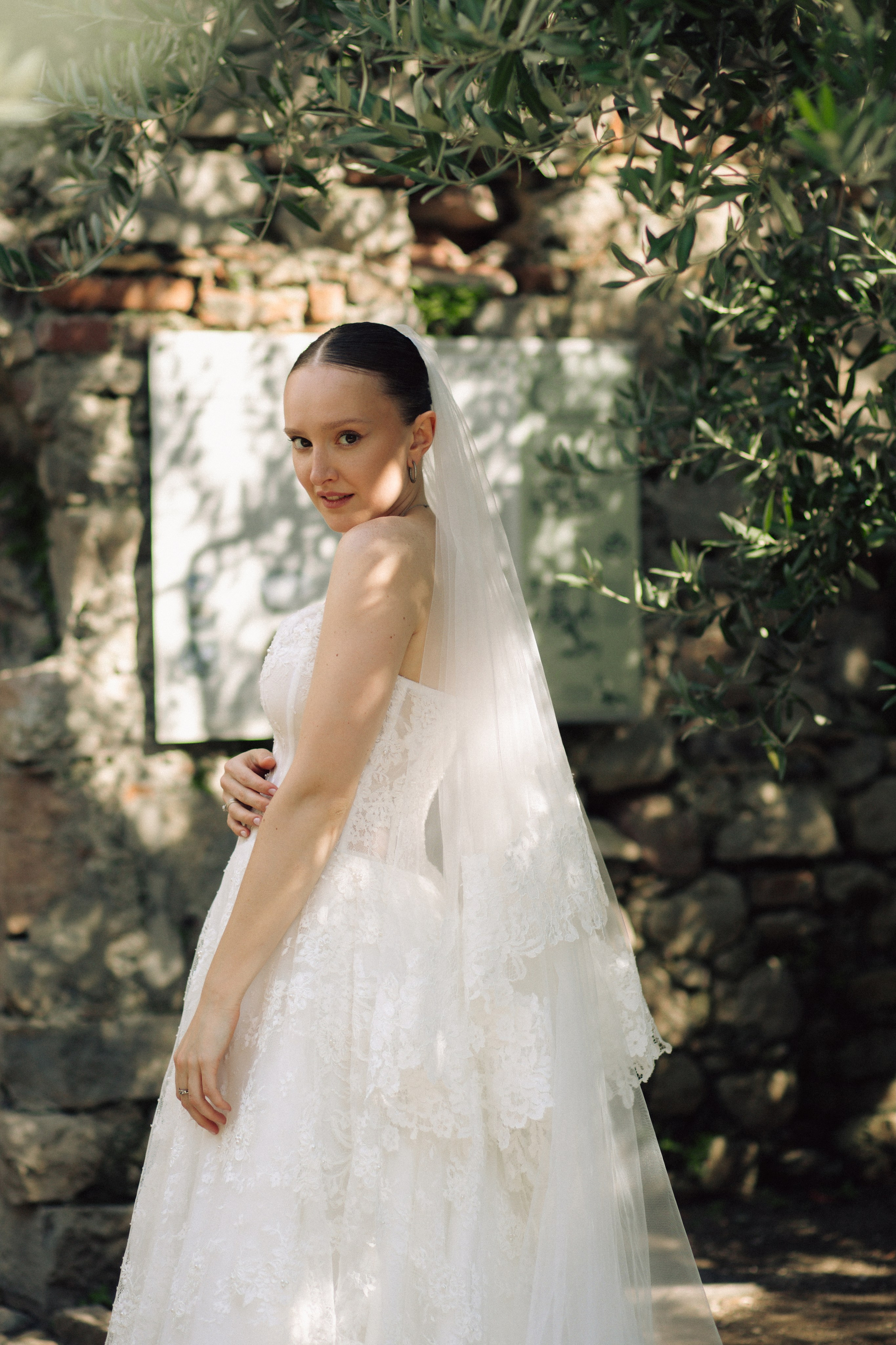 Romantic bride portrait by Lake Garda