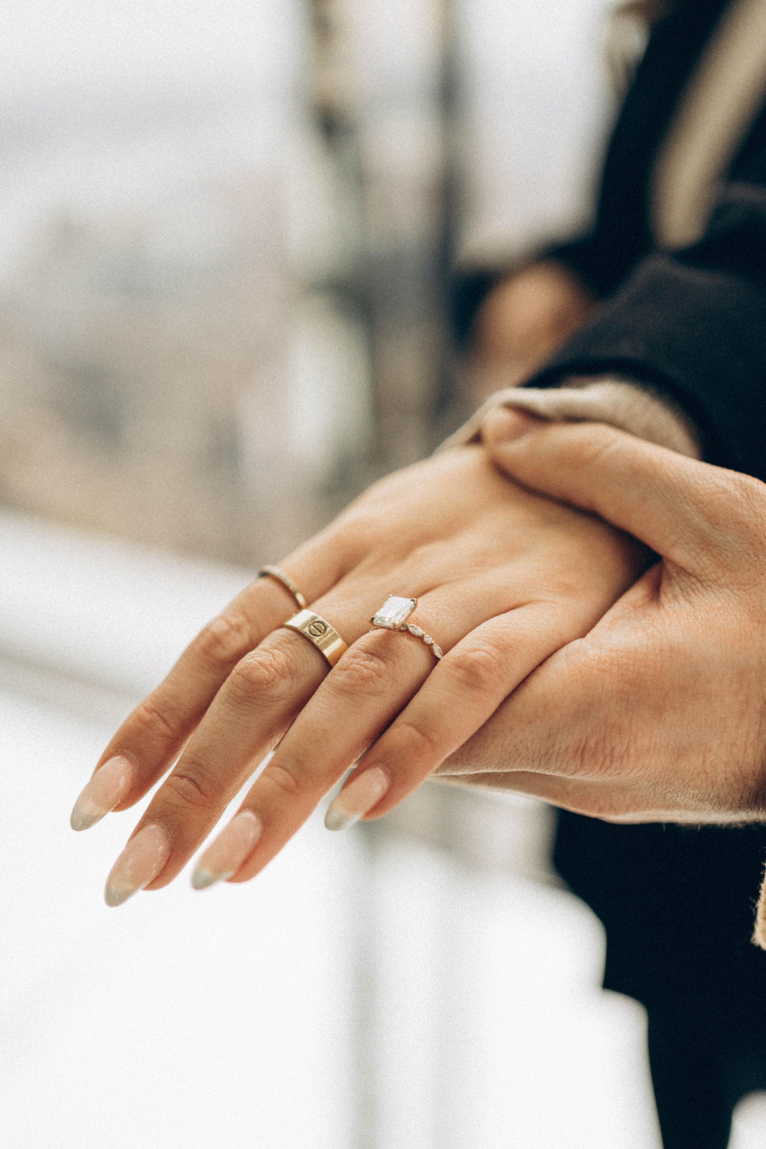 Surprise proposal by lake in Central Park summer.