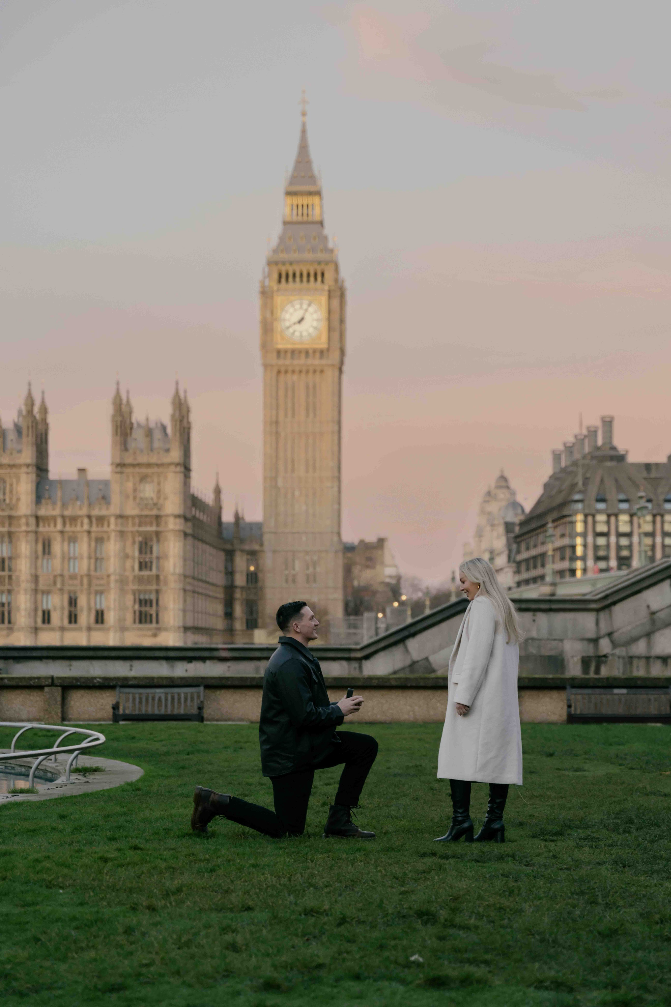 Man proposing in Westminster London at sunrise, romantic engagement moment