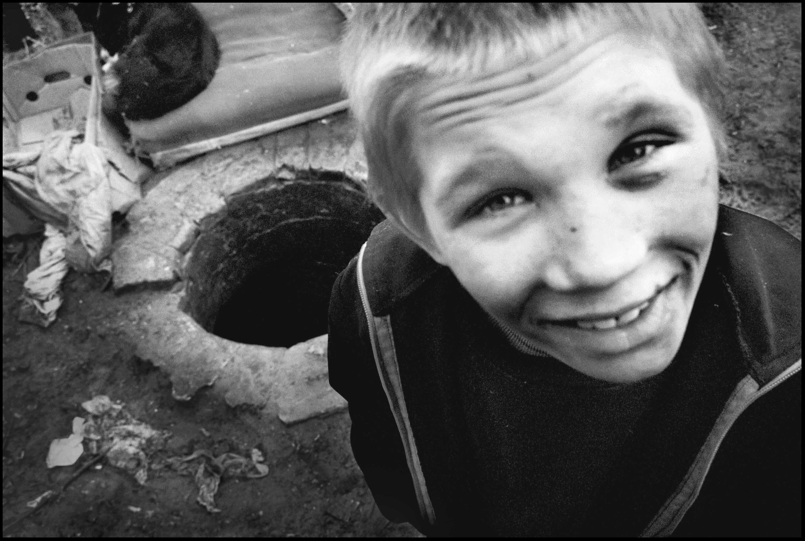 Artyom Selivanov, 9, has been living in this sewer in Kiev for over three years and has never attended school. His emotionally and physically scared brother refuses to contemplate returning home to their abusive alcoholic father. They feel that life on the streets is far better than the life they experienced at home.
