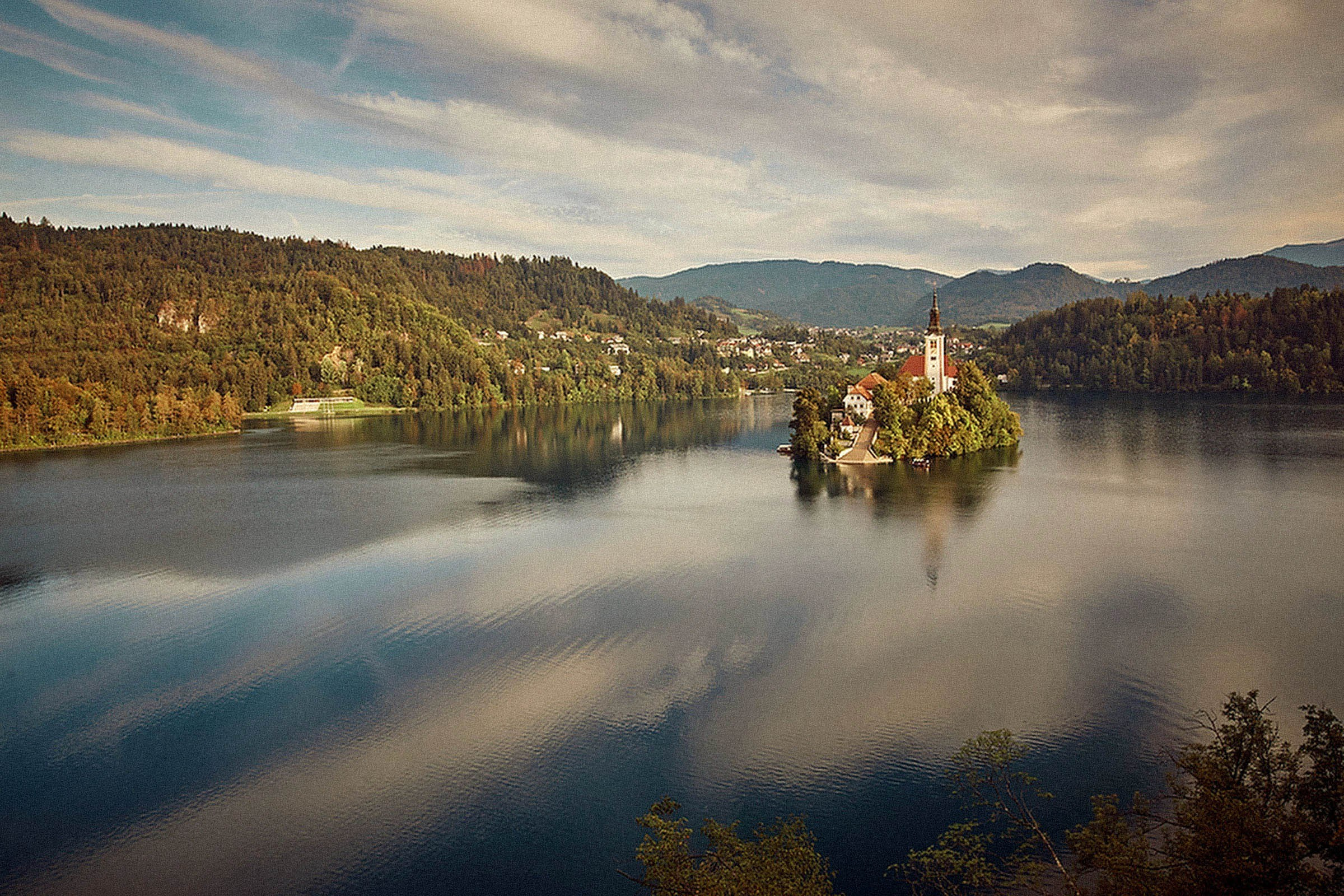 Scenic view of Assumption of Mary Church on Bled Island sunny summer day Slovenia.